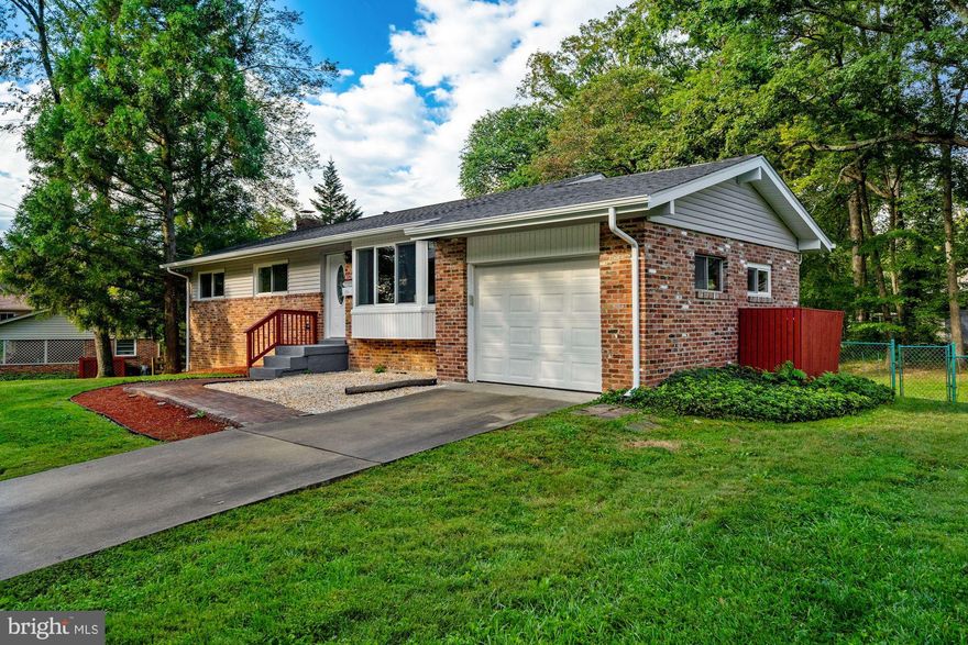 Welcome home to this beautifully updated Rambler on a private, treed, third of an acre lot in highly desirable and prime Fairfax City location! Over 2,000 finished square feet of open living space on two levels. Incredible updates and renovations in 2021 include new roof (with transferable 25 year warranty on labor and 50 year warranty on material), new windows and sliding glass doors (transferable lifetime warranty*), new gutters and siding (transferable 5 year warranty on labor), new deck, new luxury vinyl flooring, three fully renovated Bathrooms, freshly painted throughout, new front brick walkway, freshly mulched perimeter. Additional outstanding features include a single car garage with exposed brick wall, cozy brick wood burning fireplace in the lower level Family Room, cedar closets in all Bedrooms, lower level Den that could also sere as a Media Room or Home Office, storage shed in the back of the property, fully fenced and level back yard, new hot water heater, washer and dryer in 2016.  A location you can't beat... 1.5 miles to George Mason University and Eagle Bank Arena, quick drive to Vienna/GMU metro station for public transportation, convenient to commuter routes (Routes 50, 29, 66, 495), an easy walk to Fairfax City's weekend Farmer's Market, local parks, shops, restaurants, cafes, and community events, close to the Mosaic District , easy access to the all amazing sights and events in our nation's capital! This phenomenal property is ready to welcome you home!