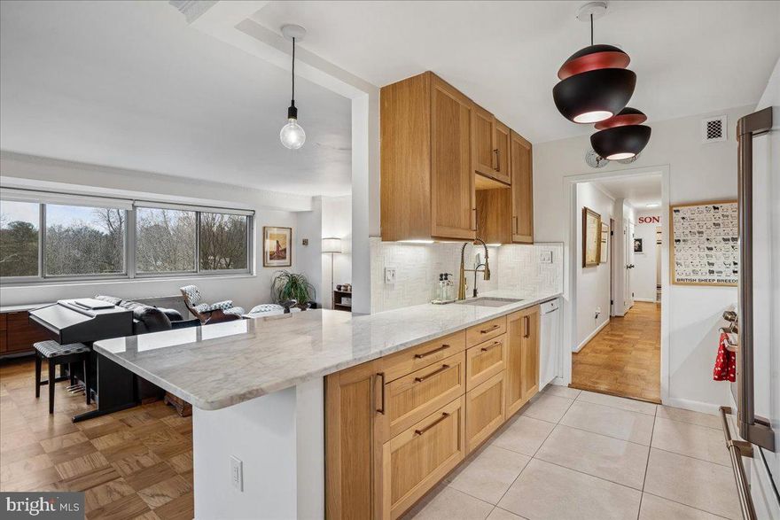 Perched above the treetops in the heart of Chevy Chase, this expansive three-bedroom, two-bath penthouse corner residence offers a rare blend of sophistication, comfort, and tranquility. Flooded with natural sunlight from multiple exposures, the space feels uniformly airy and serene—your own private sanctuary overlooking the vibrant energy just below.

Thoughtfully and meticulously renovated from top to bottom, the home showcases gorgeous hardwood floors and a cohesive, designer-curated aesthetic. At the heart of the home, the kitchen is both striking and functional, featuring pristine quartz countertops, a high-top island ideal for gathering and entertaining, a stunning herringbone marble backsplash, an elevated GE Café appliance package and designer cabinet hardware that adds a refined finishing touch. The bathrooms echo this same level of craftsmanship, with high-end finishes, warm earth tones, and timeless materials that create an inviting, calming atmosphere throughout.

The spacious layout provides exceptional flow for everyday living and entertaining, while the private balcony offers the perfect setting to unwind above it all—your own “bird’s nest” retreat at the edge of the city’s charm. Each bedroom offers spacious versatility and charm appointed with crown molding and tasteful accent walls. The sun soaked primary suite offers a tray ceiling, walk in closet with ELFA system and a designer bathroom with quartz counters, satin gold fixtures, designer sconces and a complimentary towel warmer.

Ample in-unit storage is complemented by an additional 10x12 storage space on the lower level, ensuring everything has its place.This gorgeous retreat also includes two parking spaces—one garage and one surface—adding convenience to an already compelling package. Addiitonal building amenities include EV charging stations, bike storage room, upgraded laundry facility, back up generator for power and solar panels (being installed) and a newly renovated lobby.

Ideally located just moments from the shops, dining, and everyday conveniences of downtown Chevy Chase, and steps from scenic trails and lush green spaces that connect throughout the county and into DC, this home strikes the perfect balance between accessibility and escape.

Whether you’re downsizing or new to the area and eager to explore, this is a truly exceptional opportunity to own a turnkey penthouse in one of the region’s most desirable communities. Welcome Home.

CO-OP FEE INCLUDES REAL ESTATE TAXES, ALL UTILITIES INCLUDING HEAT & AIR CONDITIONING, BIKE STORAGE, COVERED PARKING, GUEST PARKING & GREAT ADDITIONAL PRIVATE STORAGE SPACE. You don't pay transfer & recordation taxes when you buy or sell at Kenwood House Co-op.