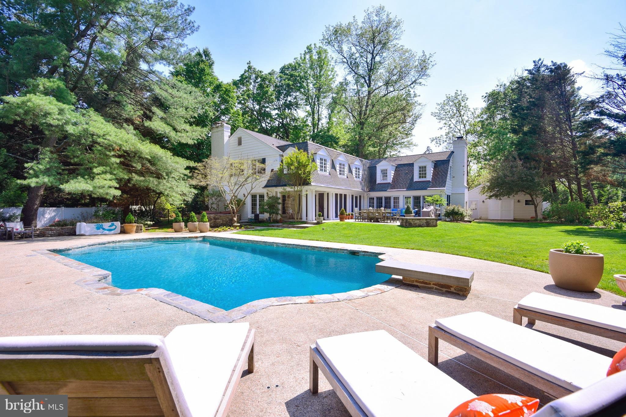 24 hour notice to show. Feel the peace of being in the country just blocks off of the Charles St corridor in this elegant 5 BR home recently remodeled by one of Baltimore's finest builders. High end finishes thruout, exquisite kitchen, large attached family room, mudroom screened porch, sun room, LR, DR, and huge finished basement. Pool house and hot tub surrounded by gorgeous patio & gardens.