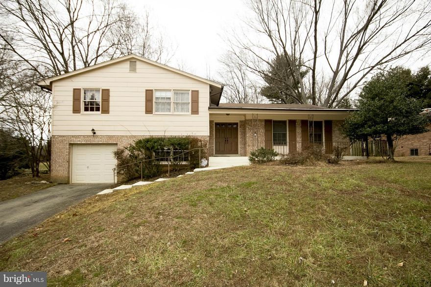 Lovely solid house in Drumeldra Hills; a little TLC will go a long way! Brick 5 bed, 3 full bath w/garage, 3500+ finished sqft, plus a bonus basement level..French door entrance to fireplace family room with amazing real wood built-in bookshelves, original HW's throughout..kitchen has New dishwasher and New stove..high ceiling lower level w/sliding glass doors, patio and private backyard..& more!!