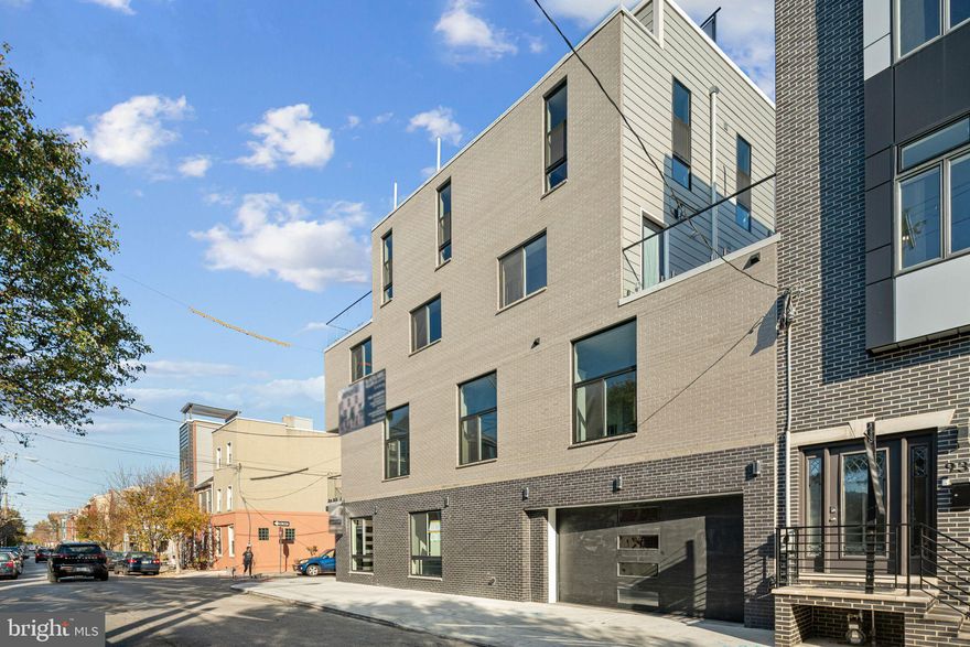 **Seller offering 2% interest rate buy down!**  Welcome to 242 Montrose Street!  Setting a new standard for new construction in Queen Village this exquisite 4000+ SF  home features luxurious upgrades throughout with 10 year tax abatement and a rare 3 car garage.  5 spacious bedrooms 5 full, 1 half bath with a gorgeous kitchen, upgraded bathrooms, wet bars and multiple outdoor spaces!  Upon entry, you'll be greeted by a grand foyer with expansive mudroom for storage, and direct access to the garage, wired for electric cars and epoxy paint throughout.

The lower level is a thoughtfully designed space featuring a wet bar with a wine fridge, sleek black and white quartz countertops, heated floors throughout, and a versatile bedroom that can serve as a guest suite, playroom, fitness room, complete with a full spa-like bath.

Ascend to the main level on a striking floating staircase with custom glass and aluminum railings lead to oak hardwood floors with a premium sound barrier underlay for quiet comfort.  Soaring 12’ ceilings and abundant natural light enhance the open floor plan. Impeccable craftsmanship is evident throughout, with the builder utilizing LVL beams for structural strength and open concept floorplan with interior wall insulation for soundproofing. At the heart of this level is the chef’s kitchen, featuring custom European cabinetry, Viking appliances, and waterfall island with black and white quartz color palette. Adjacent is a living area with floor-to-ceiling custom built-ins finished with Carrera marble, accent lighting, and a gas fireplace. Step outside to the deck off the kitchen and rear patio is accessible via a spiral staircase which features a natural gas fire pit.  

On the third level, you’ll find the expansive primary suite with custom accent wall, oversized windows, and a spacious, fully customized walk-in closet. The primary bath offers a spa-like experience, complete with heated floors, a soaking tub, standing shower, double vanities, LED mirrors, and fully tiled walls. Two additional en-suite bedrooms complete this level. The fourth floor features a wet bar with a stylish tile backsplash, perfect for entertaining on the large rooftop deck, along with an additional en-suite bedroom. The rooftop deck boasts fiberglass floor tiles, custom lighting, and breathtaking city views.

This one-of-a-kind residence offers a luxurious lifestyle that few homes can match. Come and experience all that this exceptional property has to offer. Taxes TBD; buyers are responsible for verifying square footage and tax information.