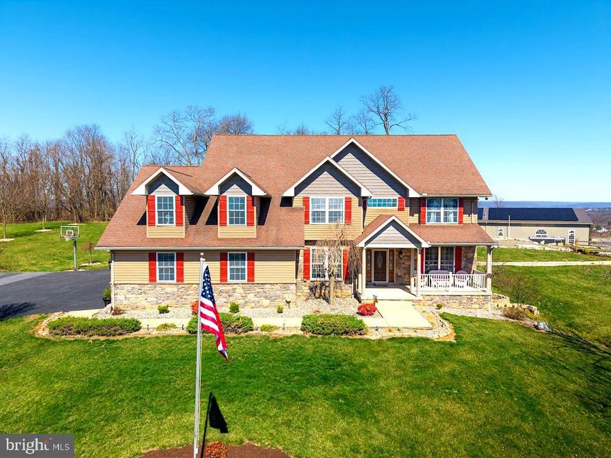 This exceptional estate, built in 2009 by renowned builders DNM Contracting INC and Acclaim Restoration, offers an unparalleled combination of luxury, comfort, and sustainability. With 4000 square feet of meticulously designed living space in the main house 5 bedrooms, 4.5 baths and an additional 1,500 square feet of finished space in the basement, this home is both spacious and thoughtfully appointed. Inside, the basement is a true entertainer's dream, featuring a full kitchen, a 24-foot bar, and not one, but two home theaters for the ultimate cinematic experience. A fully-equipped gun room, constructed with 12-inch concrete walls on all six sides, ensures the highest level of security. A wine cellar and a four-person sauna add even more luxury to the space. The main house offers four generously sized bedrooms, along with the possibility a fifth bedroom, 4 full bathrooms and one half-bath. The home has a brand new Energy Efficient HVAC system, Geothermal READY but more efficient than Geothermal,  and New solar panels on the accessory building. All closets are illuminated for added convenience. Set on 3 acres, the property boasts breathtaking views and is designed to impress. A three-car garage provides ample storage, while outside, you'll find a 20 x 40+ shaped inground swimming pool, a hot tub, and an outdoor kitchen and bar perfect for entertaining. The detached pool house features a full bathroom, a brick fireplace, and a pizza oven, making it an ideal retreat. For the enthusiast or professional, the property includes a 30 x 50 garage with 13-foot ceilings, a 12 x 12 garage door, and a 12,000-pound Titan lift. This mechanic's dream garage is equipped with a pellet stove, electricity, water, and its own kitchen. Additionally, it features a 16 x 50 lean-to for extra storage. The rear of the property is home to a remarkable 7,500 square-foot building with 16-foot high ceilings. Within this expansive structure, you'll find 1,500 square feet of living space, including a kitchen, a bath and a half, a full walk-in shower, and space set up for a bedroom, large living room, and office—perfect for a guest suite, business operations, and Income Producing such as Air B&B. The building offers generous storage and access through a 12 x 12 garage door and an 8 x 7 door for easy entry. Additionally, a 50 x 50 area with 16-foot ceilings and two 16 x 14 doors provides ample space for RVs, boats, or other large equipment. This area is conditioned with efficient gas heat for year-round comfort. This stunning property is also newly installed, fully solar-powered, ensuring a sustainable and eco-friendly lifestyle. Conveniently located just 6 miles from Harrisburg and 4 miles from Hershey, this estate offers a peaceful country setting with easy access to both cities, allowing you to enjoy the best of both worlds—seclusion and convenience. Wildlife enthusiasts will appreciate the natural beauty that surrounds the property, with plenty of wildlife passing through regularly. From its energy-efficient features to its luxurious amenities, this home is the epitome of modern living. Call for your TOUR Today!