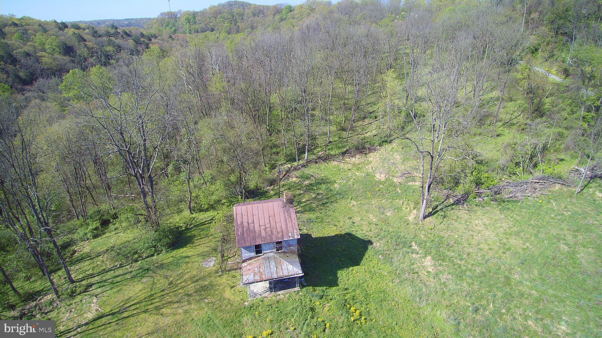Rare opportunity to find 189 acres all adjoining, 124 acres wooded with Cocolamus creek- well stocked Trout Stream- flowing through a portion of the eastern end of the property, in Greenwood Township, Perry County. Timbered in the 1960's, facing the northern side, you will be sure to find enough timber to build your own log home. While 64.7 acres is in the Millerstown Boro mostly pasture great for organic farming and has never been sprayed, public sewer and public water close by but unknown of capacity. Land is in clean and green since late 1990's. Old farmhouse on the open field portion with a well and septic on site but statis is unknown and hasn't been lived in for over 40 years. Great for a future development or build your dream home far away from the rest of the planet, enough room to even have your own runway for your own jet. Oh what money can buy? No drive Bys so call your favorite agent and pack up your gator today for a private tour.