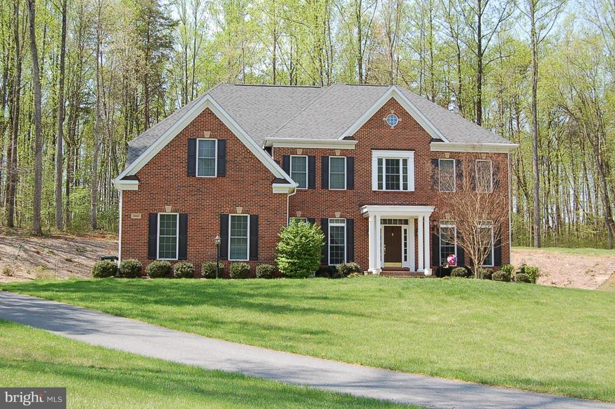 Beautiful Brick Front Colonial with 3 acres & 3 car garage. Gourmet kitchen with Granite and stainless steel appliances .  Large Master Bedroom with 2 walk in Closets,  Luxurious master bath with soaking tub. Fin. Rec room in basement with full bath. RECENT UPGRADES: ON DEMAND HOUSE ELECTRIC GENERATOR, LARGE PATIO, WINDOW TREATMENTS, CULLIGAN WATER PURIFICATION SYSTEM & CEILING FANS.