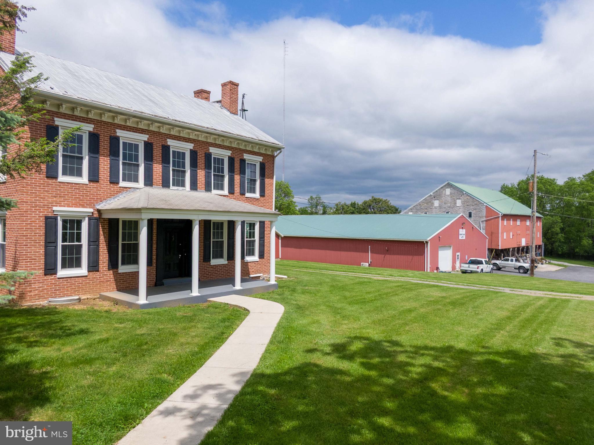 Step back in time while enjoying modern comfort in this stunning Civil War-era, all-brick 3-story charmer. Brimming with original character and craftsmanship, this 4-bedroom, 2 bath home offers generous living space, timeless details, and valuable updates including heat pump heating and cooling for year-round efficiency.
Inside, you'll find a sun-drenched sunroom, large eat-in kitchen, expansive living room, and an open staircase that adds architectural elegance. Multiple fireplaces, original woodwork, and high ceilings carry the historical ambiance throughout. An in-law quarters bedroom provides flexible living or guest accommodations.
Outside, this property continues to impress with 5.15 acres of usable land and C2 commercial zoning, giving you endless possibilities for business or personal use. Outbuildings include a massive 6,950 sq ft pole barn with two garage doors, a large bank barn, and additional storage or workspace.
Whether you're dreaming of a bed-and-breakfast, small business location, or a spacious homestead with history, this unique property offers rare potential and unmatched character.
Pole Barn comes with 2 garage doors, 2 forms of heat, bath room and wide open spaces on its own electric., ready for the next business to take posession.
Don't miss your chance to own a piece of history with room to grow—schedule your tour today!