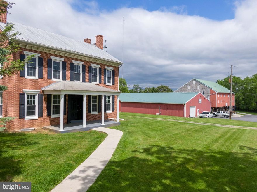 Step back in time while enjoying modern comfort in this stunning Civil War-era, all-brick 3-story charmer. Brimming with original character and craftsmanship, this 4-bedroom, 2 bath home offers generous living space, timeless details, and valuable updates including heat pump heating and cooling for year-round efficiency.

Inside, you'll find a sun-drenched sunroom, large eat-in kitchen, expansive living room, and an open staircase that adds architectural elegance. Multiple fireplaces, original woodwork, and high ceilings carry the historical ambiance throughout. An in-law quarters bedroom provides flexible living or guest accommodations.

Outside, this property continues to impress with 5.15 acres of usable land and C2 commercial zoning, giving you endless possibilities for business or personal use. Outbuildings include a massive 6,950 sq ft pole barn with two garage doors, a large bank barn, and additional storage or workspace.

Whether you're dreaming of a bed-and-breakfast, small business location, or a spacious homestead with history, this unique property offers rare potential and unmatched character.

Pole Barn comes with 2 garage doors, 2 forms of heat, bath room and wide open spaces on its own electric., ready for the next business to take posession. 

Don't miss your chance to own a piece of history with room to grow—schedule your tour today!