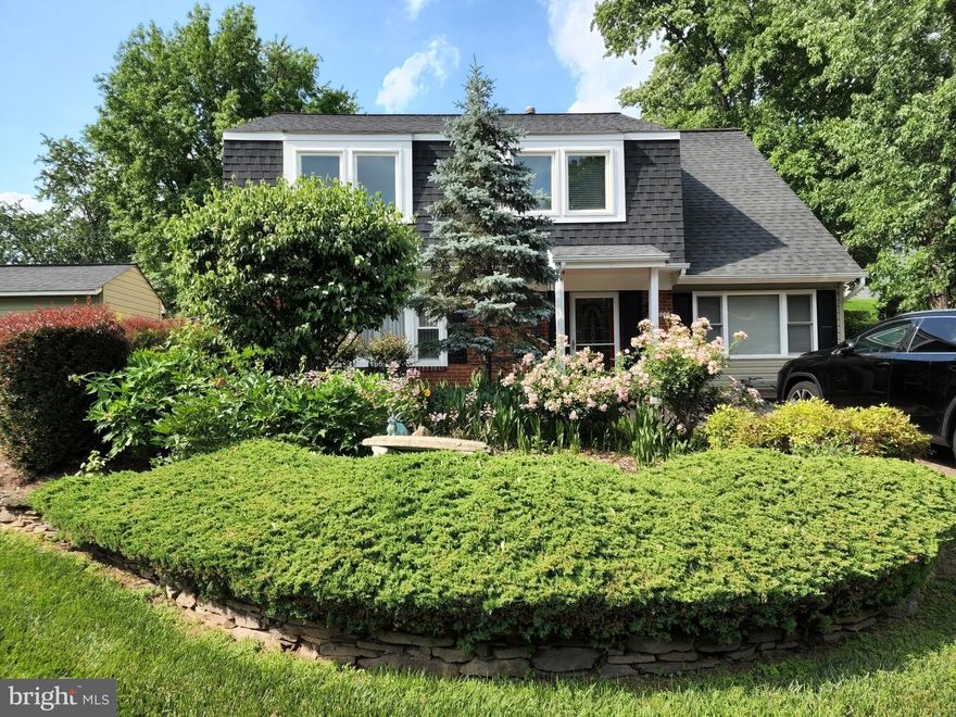 OPEN SUNDAY July 17th 12p-4p. Beautifully appointed and well-maintained custom home, with gorgeous curb appeal, in quiet and established Pointer Ridge section of Bowie!  Recently renovated (2012), this lovely spacious 5 bedroom, two level home with attic, features a great room addition, one bedroom and full bathroom on the first level, an open floor plan with hardwood floors, living room with built-in flat screen TV and surround sound, dining area, modern kitchen with spacious cabinetry and breakfast nook, office and sunroom that overlook terrace landscaping. Wet bar in great room with wine cooler and mini refrigerator. Four bedrooms and 2 full bathrooms located on the 2nd level. Master bathroom has jacuzzi tub. Skylights and extra large windows allow ample natural light. The landscape in front and rear is well maintained. Driveway houses up to 4 vehicles. Spacious deck and patio accessible from the great room leading to a beautifully landscaped backyard.  You won't be disappointed! Check out the virtual tour!