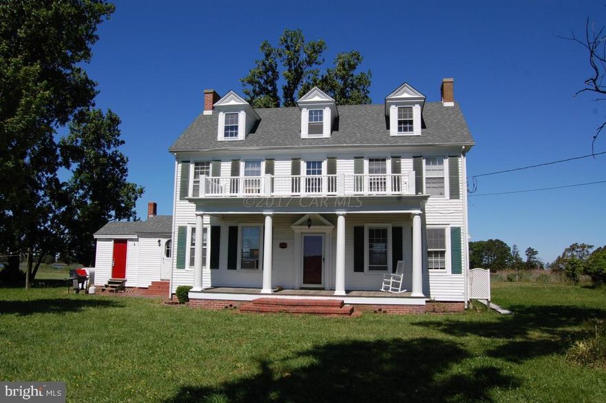 Waterfront Colonial on the Little Annemessex River in Crisfield. Beautiful views of nature across from Janes Island State Park! Dock with multiple slips. Homes needs a little TLC but could be one grand residence or weekend getaway. Almost 3 acres!