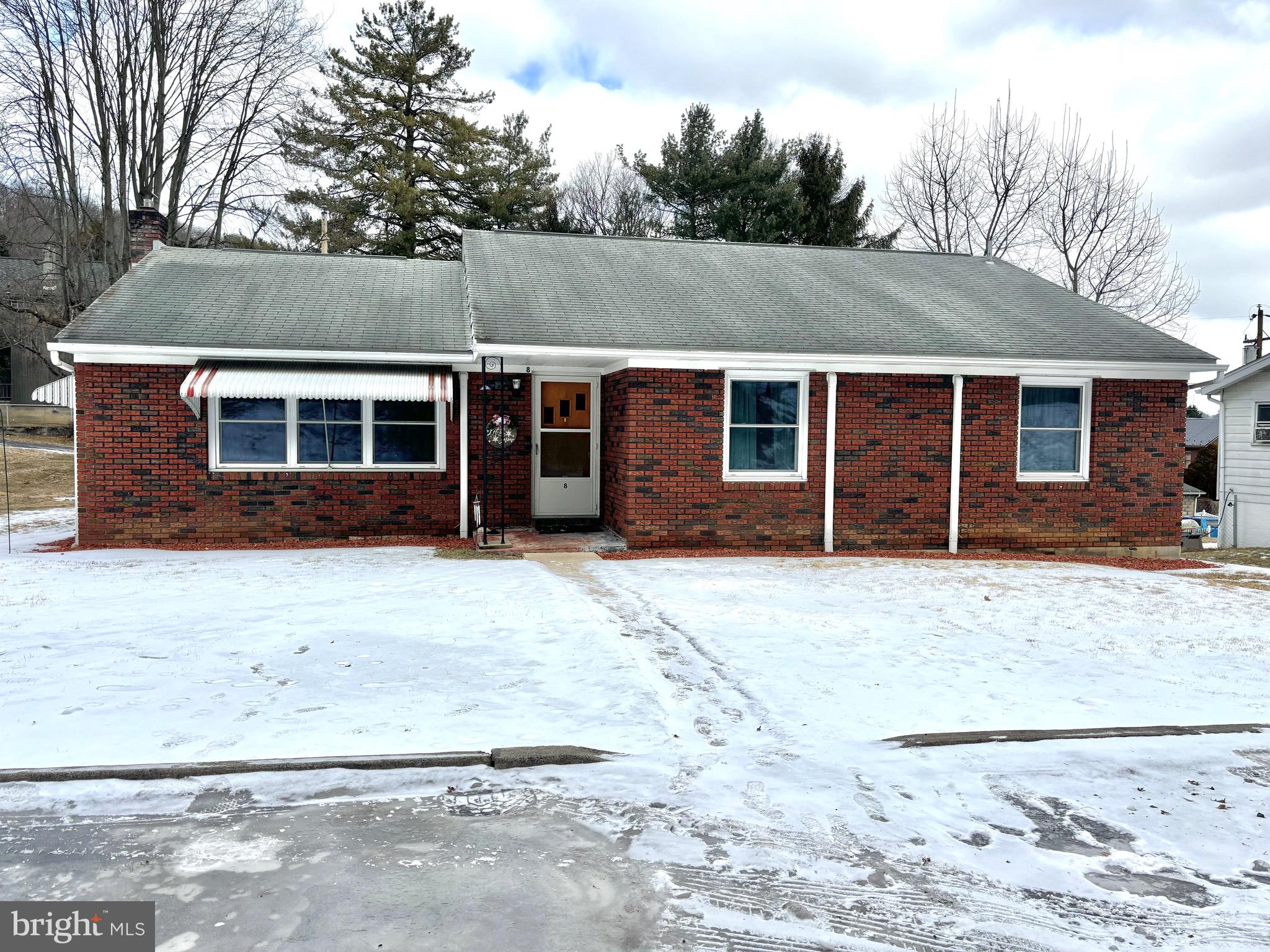 This cozy 4-bedroom, 1-bathroom brick ranch home offers 1,471 square feet of living space on a .21-acre lot, located on a quiet street. The home features hardwood flooring throughout and spacious bedrooms with large closets for ample storage.
The kitchen is fully functional and has been well-maintained. While the sellers had plans to update it, it remains in good condition and ready for use, giving the new owner the opportunity to personalize it if they wish. The home comes with newer appliances, including a dishwasher and fridge (2022), and a new stove and microwave in the basement, ready to be installed.
Five mini-split units were added to keep the home comfortable, along with a new hot water heater in 2023. Off the kitchen is a sunroom with a large serving window, providing additional space that is currently used as an office but could easily serve other purposes. It is part of the home’s temperature-controlled space and includes a back entrance.
The full unfinished basement provides plenty of storage, and the one-bay garage offers extra space for a vehicle or projects. The driveway allows for off-street parking and leads to the garage.
Outside, a new gazebo is anchored to a patio in the backyard, offering a relaxing outdoor space. This home provides a great opportunity for comfortable living in a peaceful setting, with easy access to local amenities. With its spacious layout and potential, this home is ready to provide a welcoming environment for its new owners.