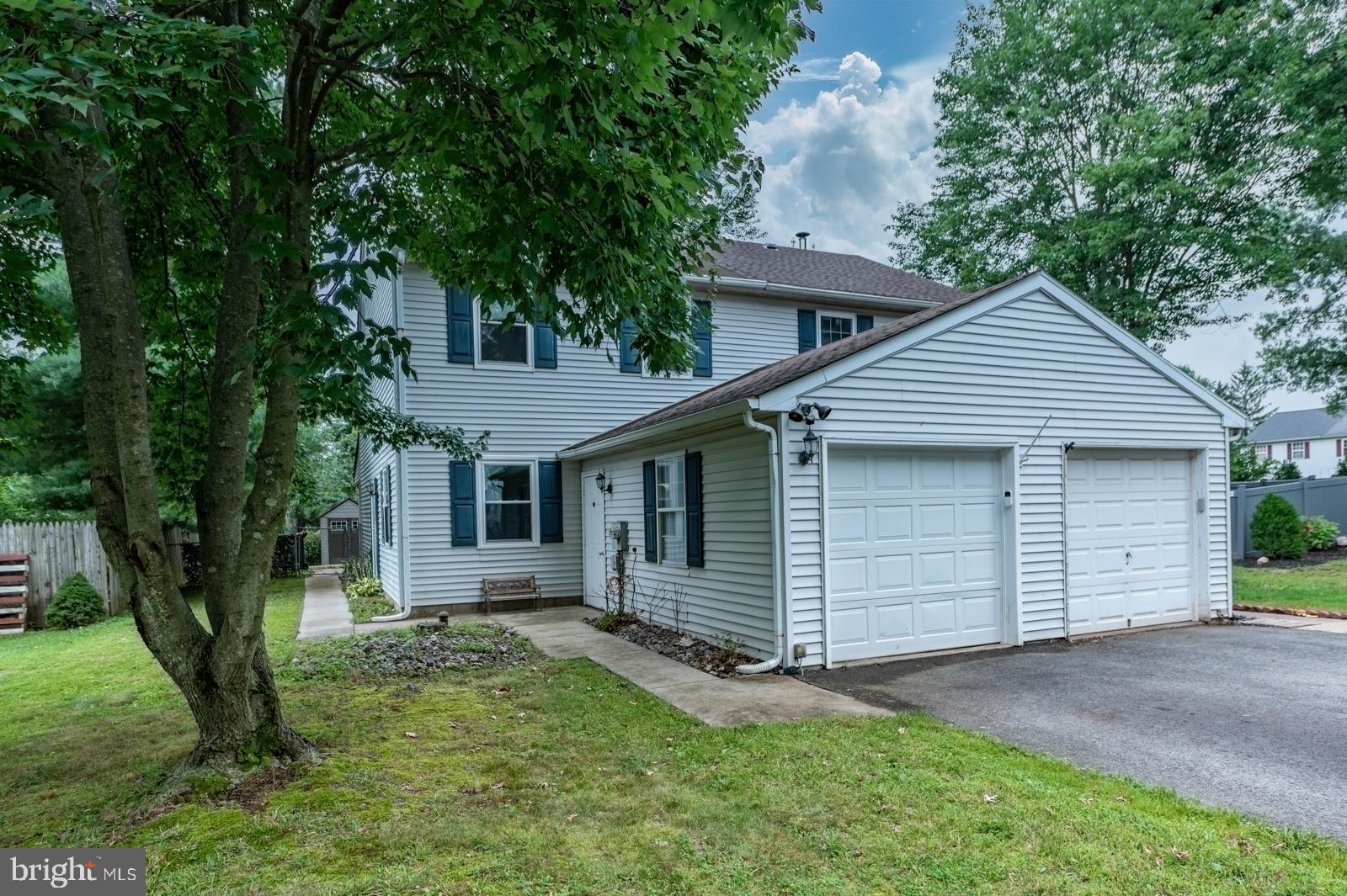 Offer deadline Monday 7/21 12pm. Welcome to this beautifully maintained 3-bedroom, 1.5-bath twin located in the highly sought-after Indian Crest development and the coveted Souderton School District. Step through the new custom front door into a spacious formal living room, perfect for entertaining. Across the foyer, the formal dining room flows into an upgraded gourmet kitchen featuring stainless steel appliances, Corian countertops, and LVP flooring. The kitchen connects to a large laundry room with a brand-new tankless water heater and direct outdoor access. Sliding doors from the dining room lead to a covered patio and a fully fenced yard with a shed—ideal for relaxing or hosting gatherings. The first floor also includes a powder room, ample closet space, and a one-car garage. Upstairs, you'll find a generous primary bedroom with a double closet, two additional sizable bedrooms—one with access to a walk-up unfinished attic offering great potential—and an updated full hall bath. Smart features include automatic timed shades that can be controlled by your phone from an app in every room, a smart garage door with mobile app access, and an exterior keypad with a built-in camera. Conveniently located near the turnpike, shopping, Harleysville baseball fields, and more—this home combines comfort, style, and modern convenience.