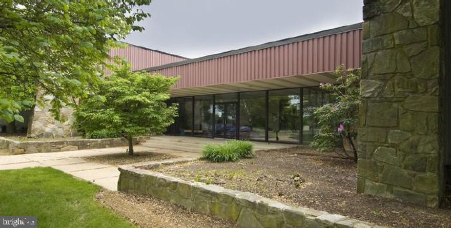 Clean warehouse with 3-phase 480 volt power, updated T-4 lighting, and 20' clear ceiling height. This space has painted block walls and sealed and painted floors. There are two 8'x10' dock doors, one leveler, and one 10'x14' grade door.