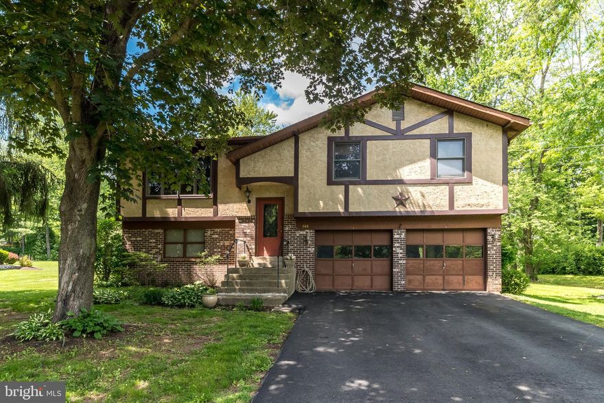This spacious bi-level 3-bedroom, 1.5-bath home sits on a peaceful ½-acre lot in a fantastic location close to everything. Tucked away on a quiet street, it features an oversized two-car garage, a large private backyard, and plenty of potential to make it your own. The kitchen offers direct access to a screened-in deck through sliding doors—perfect for indoor-outdoor living. Inside, you’ll find two charming brick fireplaces, one with propane insert in the cozy living room and another in the huge lower-level family room, which also features sliders leading to a patio. With public sewer service, this home just needs a little love to truly shine!