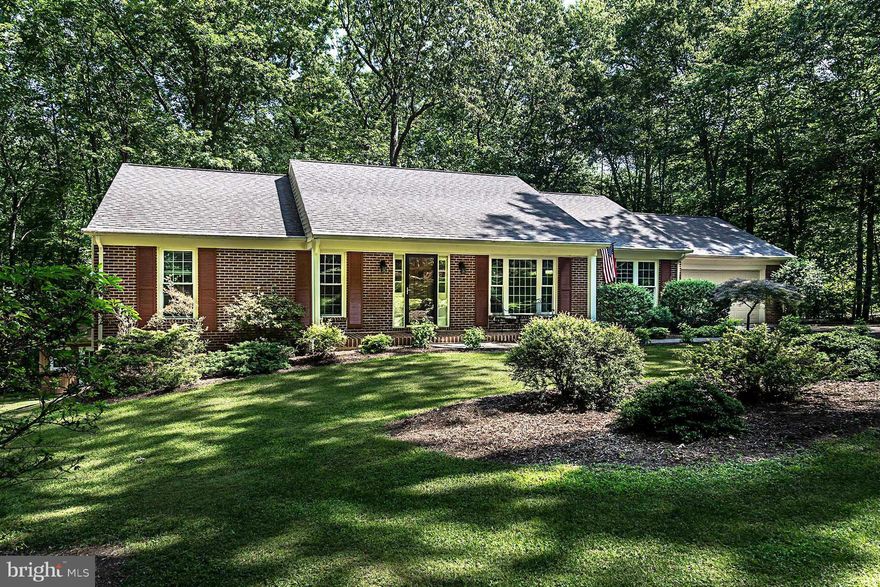 Drink in the sounds of nature while sitting on the large deck overlooking 5 acres that include meticulous landscaping. Hardwood floors.  Upgraded kitchen with granite counter tops; SS appliances, fireplace and wood stove, new heat pump(2014), jetted tub, Huge garage. Office can easily be converted to 4th bedroom. Also for sale