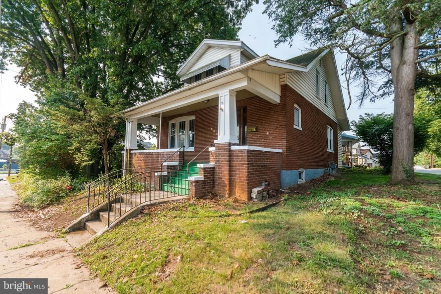 This charming all-brick Cape Cod home is situated on a corner lot boasting three bedrooms and two and a half baths, and a one-car 14x22 detached garage. This well-maintained property is sure to impress. As you approach the home, you'll be greeted by a delightful covered front porch, perfect for enjoying a morning cup of coffee or a relaxing evening with friends.  Step inside, and you'll immediately notice the fresh paint throughout, giving the home a bright and inviting atmosphere. The hardwood floors have been beautifully refinished with beautiful 8-inch baseboards, adding a touch of elegance to the living spaces. The main level features a spacious kitchen with ample cabinet space and a convenient half bath nearby. A unique pocket door separates the family room from the dining room, providing flexibility for entertaining or privacy when desired.  One of the highlights of this home is the back sunroom, where you can bask in natural light. It's the perfect spot for a cozy reading nook or a tranquil space to unwind. The unfinished walkout basement not only provides additional storage options but also houses a full bath and workshop area for those who enjoy DIY projects or hobbies. From the basement, you can access the spacious fenced yard, offering a secure and private outdoor retreat for relaxation, gardening, or entertaining.  This home has been thoughtfully updated with modern conveniences. The plumbing has been updated, ensuring efficient functionality, while replacement windows enhance energy efficiency and noise reduction. A new hot water heater ensures a steady supply of hot water, and the newer roof provides peace of mind and long-lasting durability. Lastly, this property offers great storage space under the front porch, perfect for stowing away seasonal items, outdoor equipment, or any additional belongings. Great location with easy access to shopping and restaurants as well as I81 and I70.