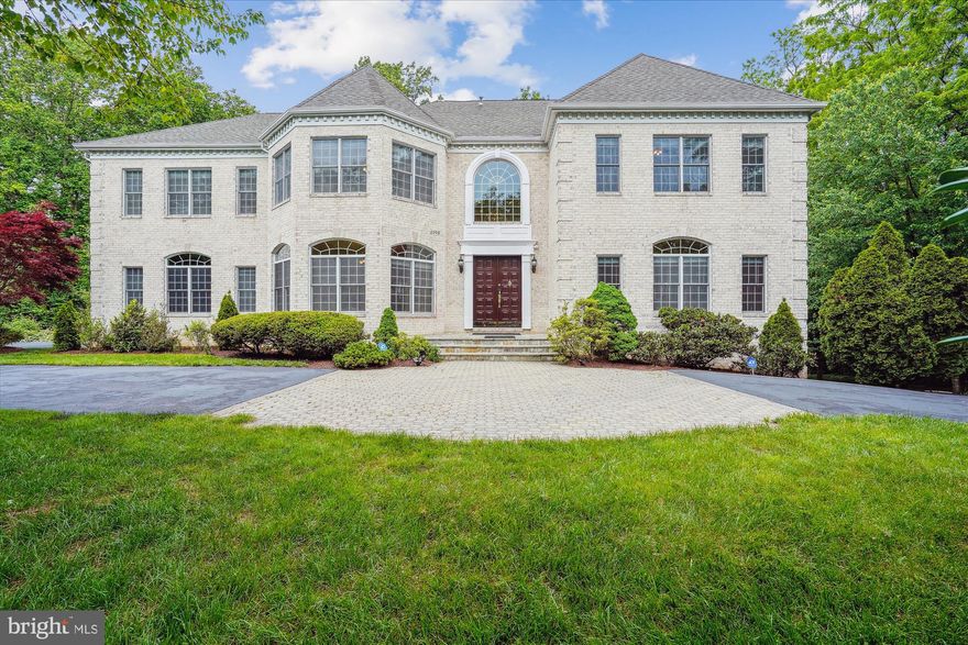 This magnificent custom-built residence nestled in a secluded enclave seamlessly blends classic elegance with modern comfort. Boasting 7 bedrooms, 5 full and 2 half bathrooms spread over 10,000+ square feet, it's an entertainer's dream or a sanctuary of solitude. The home features over 80 Proline Pella windows/doors, smart-wired security, 3 HVAC systems, and a grand 2-story foyer with marble flooring and a curved staircase.

The formal living and dining rooms dazzle with hardwood floors, crown molding, and Palladian windows. A chef's kitchen awaits with top-tier stainless steel appliances, granite countertops, and a sunlit breakfast area. A sunroom overlooks the lush yard, while a 2-story great room offers a gas fireplace and access to a Trex deck.

Upstairs, 4 spacious bedrooms, including a stunning owner's suite with a fireplace and spa-like bathroom, await. The lower level features a recreation room, bar area, media room, and two bedrooms, perfect for guests.

Situated on a private 29,000 sq ft lot, minutes from amenities and major routes, this home is a masterpiece of luxury and convenience. Welcome and enjoy!