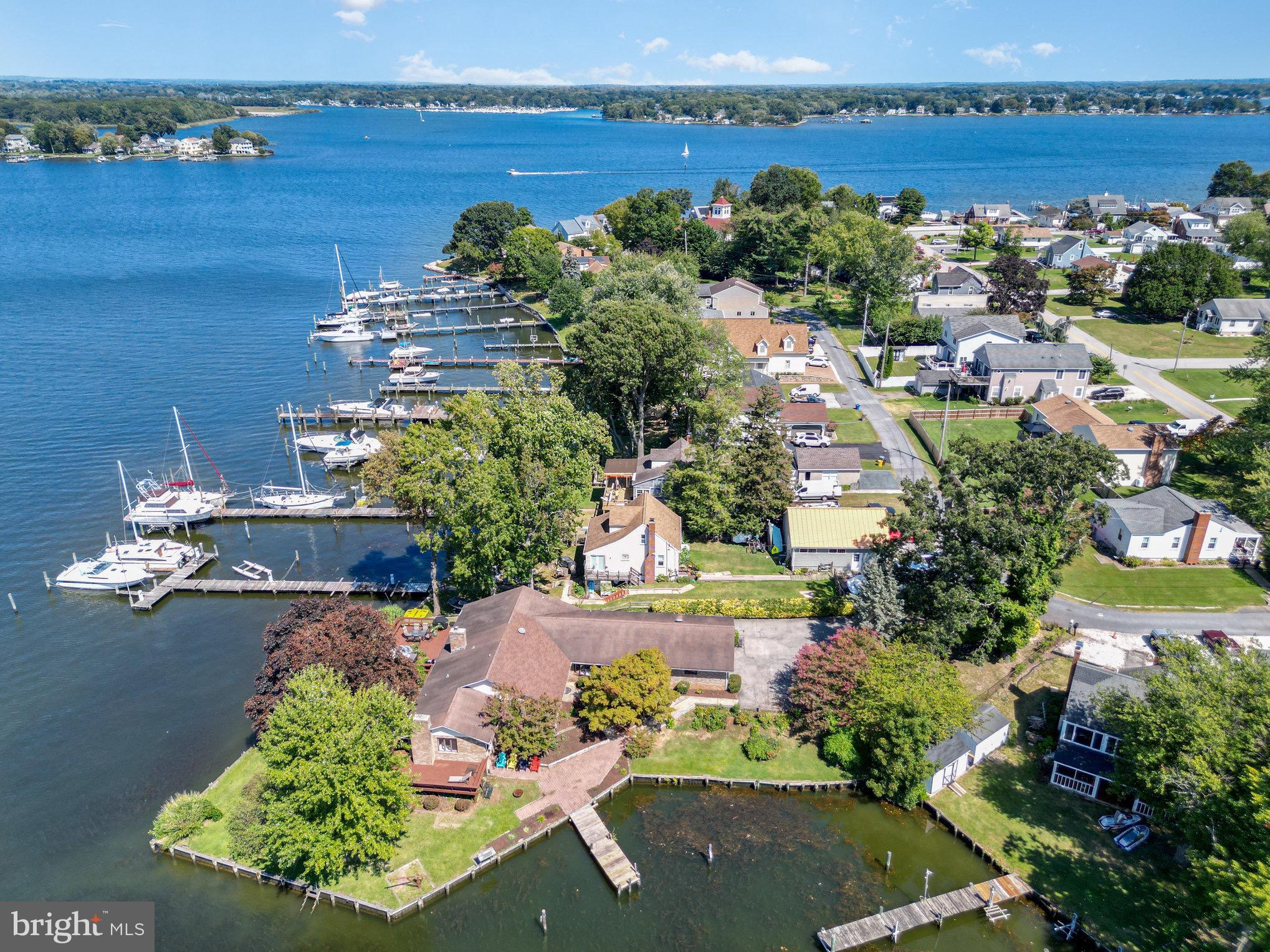 Welcome to this 3 bed, 2 full bath rancher surrounded by water on over 300 feet of gorgeous water frontage on Middle River. Wildlife abounds here, whether you are a bidder, fisher, crabber or just a boater, this is your paradise. This property sits on a hard to find point with 5 foot of water on all sides to allow easy access for even the larger boats. It comes with a two car garage, an over 1800 square foot deck that surrounds the home with beautiful views on all sides, and a pier for docking your water vessels at. Inside are two full baths and three bedrooms, a laundry room, living room, and tiled hallway to the tiled full kitchen which opens into a large great room that gives phenomenal views of Middle River from inside. The whole house is entirely ADA accessible and was built for wheel chair maneuverability. The water here gives easy access to the Chesapeake Bay and all the waterfront bars and restaurants in the surrounding area are only a few minutes away. The lot is not only surrounded by water but is beautifully landscaped for relaxing and enjoying the sunsets or hosting friends and family. This is truly a slice of paradise away from the big city. Come see it and fall in love today!