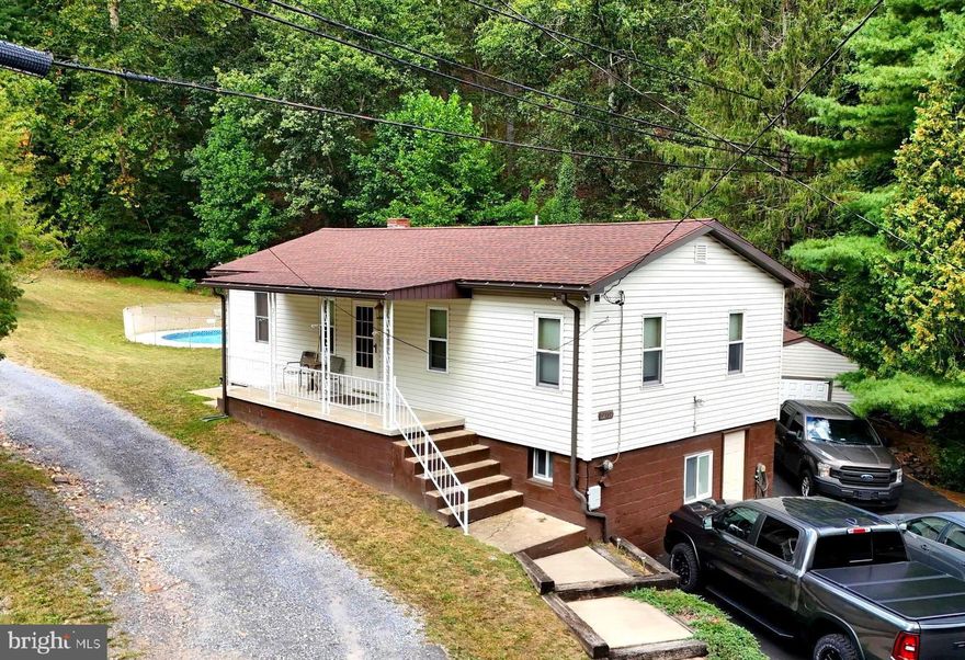 Don’t miss this rare chance to own a home with over 90 acres in the desirable Bowling Green area. Located just outside city limits, this property offers the perfect balance of privacy and convenience—only minutes from I-68, LaVale, and Cumberland, and an easy commute to Northrop Grumman. The property features a 4-bedroom, 2-bath home with a paved driveway, an inground pool, and a pool house. The main level includes 3 bedrooms and 2 full bathrooms, including a spacious primary bedroom. The basement includes 1 bedroom that has been completely remodeled a few months ago. The home has also undergone extensive professional improvements to the drainage system and basement, giving peace of mind to future owners and adding long-term value. Step outside and explore everything this land has to offer: Over 90 acres of usable land, Natural spring on the property, Custom hunting shack with scenic views, ATV/side-by-side trails throughout, Frequent animal sightings (deer, bear, coyotes, and turkeys), and A cleared, flat build site—perfect for your future dream home. Whether you’re looking to build, invest, or enjoy outdoor living, this property offers unmatched flexibility. Live in the existing home while building your custom home in the woods, then rent or sell the original house—the possibilities are endless. Utilities are available at the road, making future development even more accessible.Imagine mornings with coffee overlooking the mountains, afternoons exploring your own trails, and evenings under the stars—this is more than a home, it’s a lifestyle. If you’ve been searching for space, privacy, and potential all in one property, this is it!