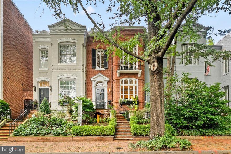 This outstanding Georgetown home is back on the market due to a home-sale contingency.  Situated in East Village, this storybook 1887 townhouse has been recently renovated and updated throughout; preserving its classic appearance and maintaining its charm. This home offers 2,750 square feet of living space with 3 bedrooms and 3/1 bathrooms. Features include original wood flooring and windows, Italian tile, high ceilings, crown moldings, and three fireplaces located in the living room, family room, and primary bedroom; all which have been converted to gas with logs. The gourmet kitchen features marble counters and new appliances - a Stainless Steel Italian Refrigerator, Miehle Dishwasher, Rohl Kitchen Faucet, and a refreshed and repainted appearance. The upper level has two large bedrooms and two full bathrooms, the primary bedroom includes a new primary bathroom, new mahogany wood doors, and a Juliette balcony that overlooks the front of the home. The lower-level suite has a large bedroom with built-ins, a living space, laundry room with new appliances and tilework, full bathroom, and the previous unfinished closet space has been converted into a retro kitchen with all new appliances. New Central AC, New Boiler, and a New Unlimited Hot Water System function throughout the entire home as well as a newly implemented basement level heating and AC system with a mini-split unit. French doors in the formal dining room enter into the rear garden which has been excessively landscaped with new plants and grass, lower terrace stonework, a new stone terrace top level with brick work, and a new fence. Both the front and the rear include solar panels, automated irrigation, and lighting systems.