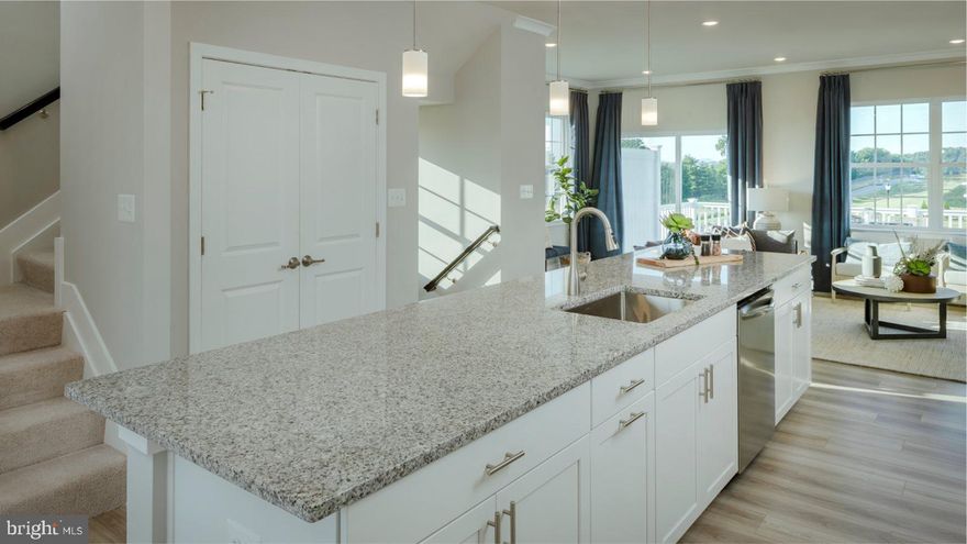 This 3 story townhome end unit features a modern, open-concept design that provides ample room to grow and entertain. The foyer leads to a one car garage with double wide driveway, and spacious recreation room that can easily operate as a TV room, game area or just a quiet place to curl up in with a good book.  The upstairs is the main living area of the home, the family room is excellent for relaxing, hosting movie nights with loved ones and daily activities, the deck provides an outdoor living space, the well-equipped kitchen with Island and stainless-steel appliances is great to serve piping-hot meals straight off the stove and host delicious meals of all sizes.  Conveniently situated near the kitchen, the dining room features a casual elegant ambiance that makes guests feel right at home at mealtimes.  Occupying the third floor is a private owner’s suite with an en-suite bathroom, two secondary bedrooms and laundry closet.

Prices, dimensions, and features may vary and are subject to change. Photos are for illustrative purposes only and not of actual home.