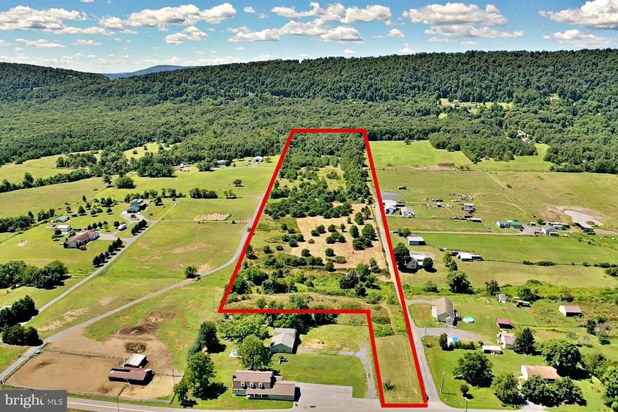 Rare opportunity to own 27. 39 unrestricted acres with beautiful mountain and orchard views in a fantastic location! This property has acres of flat Meadows, a lively year-round pond, multiple streams, and acres of valuable old growth woods that offer tons of privacy, perfect for those who love spending time outdoors or is looking for some peace and quiet from the outside world. All of this within 15 minutes of major shopping and schools and close proximity to the Virginia line. With tons of options for build sites and approved Class 2 perc, the land is perfect for a luxury home, horses or homestead. The possibilities are endless, let your imagination run wild. The property can also be subdivided into multiple large lots & the dedicated entrance on Reunion Corner Road is ALREADY permitted for a six lot subdivision. Since the property is unrestricted, it can also be developed for commercial use. No HOA and no right-of-ways!  A blank canvas that awaits you to bring this masterpiece to life, schedule your showing today!