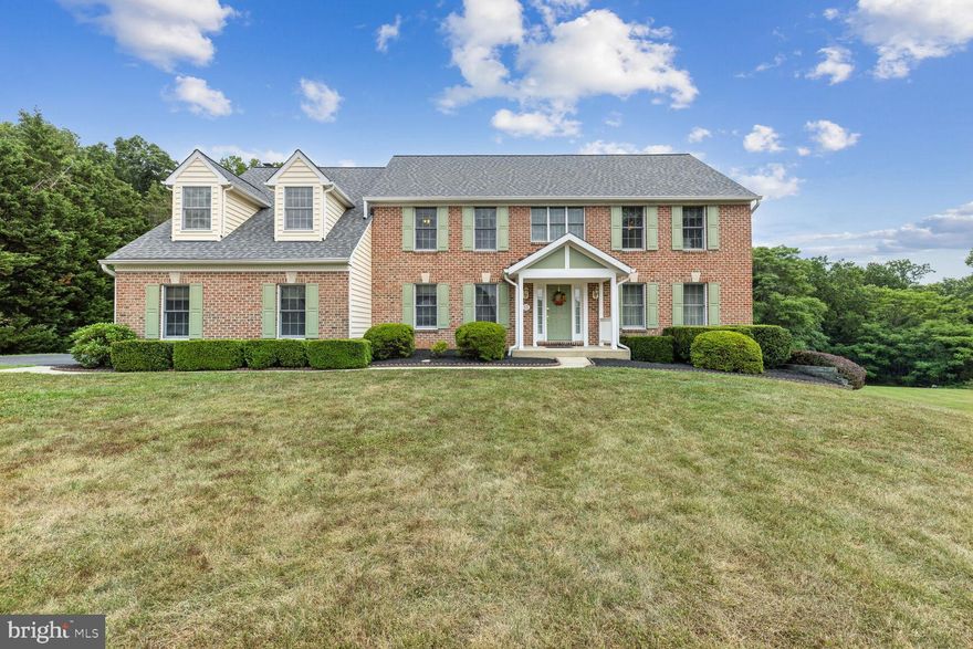 OPEN HOUSE SUN 7/21 1-3PM!! Welcome to a Brick Front Colonial w/ 2 car garage,  5 BR 2.5 BA Family Home on 1.39AC in the Community of Manor Fields in Baldwin. The Main Level features 2-Story Foyer w/a wide curved staircase, hardwood, Coat Closet and Half Bath. The Living Room and Formal Dining Room is to the right of the foyer w/Crown Molding, Chair Railing, Plenty of Windows to let the natural light in. The eat-in Kitchen features granite countertops, a center island w/Linear Pendant Lights, 2  pantries, Stainless Steel Appliances, Breakfast Bar and a Breakfast Area w/Chandelier and Sliders to the Screen-in Porch w/Ceiling Fan and Lights, along with access to the Large Deck w/walk down stairs to the Yard. The family room invites you to unwind with a Charming Brick Wood-Burning Fireplace, great for cozy movie nights. Convenience is key on the main level, with a Laundry Room w/Shelves that provides access to the Office w/Closet and 2-Car Garage. Upstairs you will find the Primary Bedroom with 2 Walk-in Closets, Ceiling Fan w/Lights, a Primary Bath with a shower, soaking tub and 2 Sinks w/Large Quartz Counter, Large Mirror, Lights, Drawers, Cabinet and Vanity. Four additional bedrooms w/Ceiling Fan and Lights and a second full bathroom with 2 Vanity Sinks w/Large Quartz Counter, Drawers, Cabinets, Mirrors, Lights, 2 Linen Closets and Tub/Shower round out the upper level sleeping quarters. The lower level offers over 1,500 square feet of space, shelving, rough-in, Windows and Walk-out Slider to the Yard, awaiting your finishing touches to configure to your needs. Outdoor living is a delight on the Large Deck and Screen-in Porch overlooking the expansive yard ideal for outdoor enjoyment and entertaining. Also included, an invisible dog fence 2/3 around the Backyard. Close to the town of Jacksonville. Grocery stores, restaurants, pharmacy's, fitness centers, walking trails, what more could you ask for?