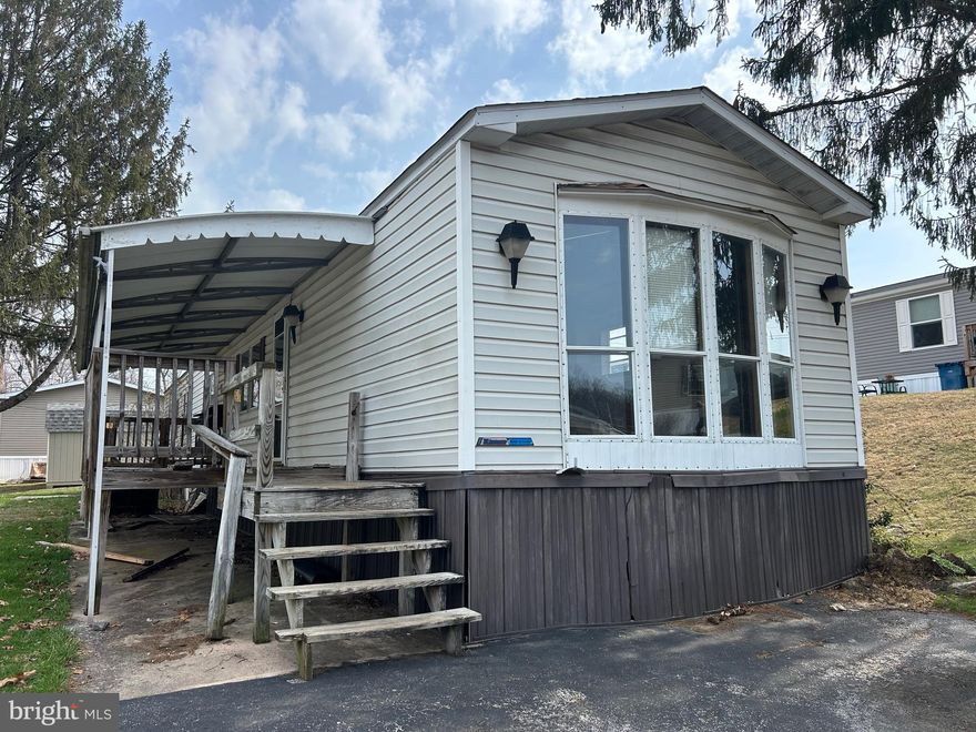 HOME MUST BE MOVED BY BUYER – THIS HOME CANNOT REMAIN IN THE PARK. Great opportunity to own a well-maintained mobile home ready for relocation! This home features a spacious eat-in kitchen with plenty of room for dining, a large and inviting living room perfect for relaxing or entertaining, and a full bathroom equipped with convenient his-and-hers sinks. In addition, there is a versatile bonus room on the side that can be used as a family room, office, or flex space, complete with access to an extra deck for outdoor enjoyment. Ideal for buyers looking to place a home on their own land or in a new location—don’t miss this unique opportunity!