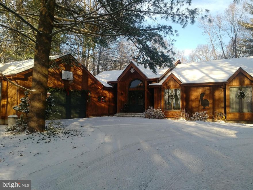 Contemporary rancher with cedar siding nestled on a 1+ acre wooded lot on a non-thru street.  Home features: MBR walk-in closets w/custom shelving, cathedral ceilings, hardwood floors, ceramic tile, dual vanities, 6 car driveway including a  2 car garage, deck w/ view of woods and above ground pool.  Must see this property to appreciate all of its features.  1 year HMS Home Warranty included.