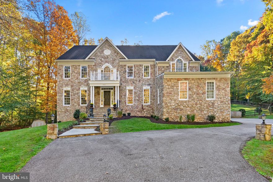 Imagine living in a home where every day feels like a retreat, where your personal haven is nestled on over 5 acres of usable and picturesque wooded property in a private neighborhood. This is no dream; it's a reality, and 10633 Timberidge Road is ready to welcome you with open arms. As you drive to the home via an extended driveway, you'll be greeted by a magnificent single-family residence boasting a gorgeous stone facade, offering a glimpse of the luxury and comfort that lies within.
Upon crossing the threshold, a grand foyer with a stunning chandelier beckons, setting the stage for the luxurious living that unfolds beyond. To the left, an inviting room awaits, offering the flexibility to be a sitting room, office, or library, tailored to your needs. Continuing your journey through this captivating home, another office with a built-in bookshelf and gas fireplace beckons, just off the spacious living room.
To the right of the foyer, a generously sized dining room, adorned with another striking chandelier, promises memorable gatherings with friends and family. On the opposite side of the foyer, you'll find the amply sized living room, boasting vaulted ceilings and a two-level, wood-burning stone fireplace. From here, you can take in the magnificent views of the tranquil backyard, swimming pool, and gazebo – a serene and picturesque setting that becomes your daily backdrop.
The kitchen is a chef's dream, featuring granite countertops, a kitchen island, 42-inch cabinets, stainless steel refrigerator, wall oven, and microwave. It's not just functional; it's beautiful. The kitchen also includes a cozy breakfast nook, where your mornings will start with sunshine and coffee.
The mid-level is thoughtfully designed with a mudroom leading into the laundry room, complete with a washer and dryer, making everyday chores a breeze.
Upstairs, the master bedroom is a true retreat. vaulted ceilings, a gas fireplace, two large walk-in closets, and a sitting area make it the perfect space to unwind after a long day. The master bathroom boasts a walk-in shower, a soaking tub, and two spacious vanities, providing a spa-like experience in the comfort of your own home.
The upper level also houses three large secondary bedrooms, with one having a private bathroom, and the other two sharing a Jack and Jill bathroom. Ample space and privacy for all your loved ones.
The basement is a haven for entertainment, featuring a potential wine cellar and a theater room just off the lower-level staircase. With new LVP flooring and fresh paint, the basement is ready to accommodate your leisure activities.
An additional large room can be used as a guest bedroom, rec room, or anything your heart desires. The basement provides additional space for storage, recreation, or creating your dream space.
Don't miss this unique opportunity to own a piece of tranquility and luxury in Fairfax Station. Schedule a viewing today and experience the best of serene, elegant living in a charming colonial-style single-family home. Your dream home awaits!

As one journeys outside, they will find the exterior of this property is a sanctuary in itself, with vibrant tree colors in autumn creating a breathtaking backdrop. You'll discover a beautiful pool in the backyard, perfect for cooling off on hot summer days, with 8.5 feet at the deep end and 3.5 feet at the shallow end. The newly spruced up back deck with a gazebo is an ideal spot for al fresco dining and entertaining. Parking is a breeze with the convenience of a three-car garage, and a fenced-in beautifully manicured backyard.
The neighborhood is just minutes to the Fairfax County Parkway, Route 123, VRE, Burke Lake Park, Historic Clifton and Fountainhead Regional Park. Fountainhead Park has an abundance of hiking, bike and equestrian trails and spectacular views of the Occoquan River. So private and yet, shopping, restaurants and grocery stores are just down the road. Tours are by appointment only.  Tours starting Nov. 2nd