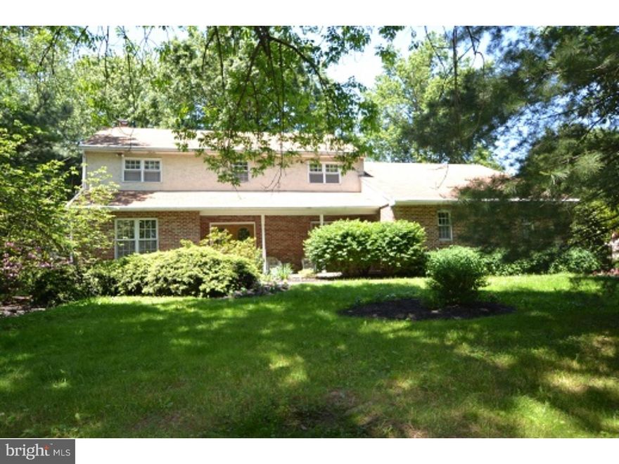 Welcome to this lovely home situated on a full landscaped lot offering privacy off the road. This home has ample sized rooms, fabulous hardwood floors, excellent storage space & gracious living. An inviting living room,great room with fireplace and a garden room for entertaining! There is a gourmet kitchen for the cook(s) and a breakfast room for relaxing and enjoying meals along with a good sized dining room. From the foyer, circular stairs lead to four bedrooms, including a main bedroom with bath and walk-in closet. A first floor laundry room and a two car garage help make this home very livable!!