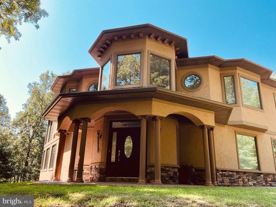 Discover unparalleled privacy and potential on this extraordinary 76-acre estate, featuring a beautifully crafted 4,000+ sq ft residence, designed for comfort, functionality, and timeless elegance. Nestled amidst the Appalachian foothills, this 4-bedroom, 3 bath home offers a perfect blend of rural tranquility and high-end living.

Inside, the expansive floor plan boasts soaring ceilings, generous living spaces, and panoramic views of the surrounding countryside. The gourmet kitchen is a chef’s dream, with premium appliances, granite countertops, custom cabinetry, and a large island for entertaining. The spacious primary suite includes a spa-like granite bathtub and walk in closet while three additional bedrooms offer plenty of room for family or guests.

Step outside and enjoy the perfect setting for gatherings or quiet evenings on the patio, complete with a built-in grill station—ideal for outdoor entertaining. A 2-car attached garage adds everyday convenience and extra storage

Outdoors, the possibilities are endless. In addition to the pristine acreage—ideal for farming, hunting, or recreational use—the property includes a large outbuilding for tractor and equipment storage, and a separate 2,400+ sq ft blacksmith/metalworking/woodshop. Whether you’re a hobbyist, craftsman, or artisan, this estate has the infrastructure to support your passions.

Located just minutes from Rocky Gap Resort, downtown Cumberland, Western MD scenic railroad and the historic C&O Canal, with convenient access to major highways this property offers both seclusion and accessibility.