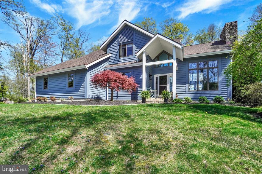 You will fall in love with this spectacular contemporary home tucked back on a level, 1.4 acre lot surrounded by nature and mature trees for the ultimate private retreat! Beautifully maintained and renovated inside and out, quality finishes and updated components offer peace of mind and unparalleled comfort for everyone on your list. The home's main entry reveals an open, naturally lit interior with walls of windows, vaulted ceilings, all new LVL floors in main level, and impressive 2-story great room with wood burning, floor-to-ceiling stone fireplace and open staircase, flowing seamlessly into the formal dining room and kitchen areas. The expertly upgraded kitchen with new cabinets, quartz counters, stone tile backsplash, high-end appliances, breakfast area and huge island sure to delight your inner chef.  The adjacent cozy family room is a perfect place to relax, with wall-mounted fireplace and sliding glass doors to backyard entertaining spaces. A powder room and well-designed laundry room complete the first floor. Upstairs, three generous bedrooms include a fabulous primary suite with cathedral ceilings, walk-in closet and brand new upgraded bath with tile shower, soaking tub and new double vanity currently being completed! All baths have been updated, including handsome LVL flooring. Additional living space in the finished lower level features a large family/rec room, plus an office or guest room, exercise room, and full bath.  The exterior has been given careful attention as well, with freshly painted cedar siding, new roof,  and wonderful fenced backyard with two decks, pergola and natural field stone patio perfect for everyday fun and warm weather gatherings alike. Off the beaten path but close to small town shops, dining, Rte. 24 & MD line, you can enjoy the best of country living without sacrificing convenience. This turn-key property is ready to become your dream home, just unpack and start living!