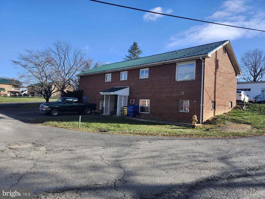 QUADRUPLEX MULTI-UNIT RENTAL, EXCELLENT INVESTMENT OPPORTUNITY! 4 UNIT'S TOTAL. 2 (1BDR APT.), 2 (2BDR APT.). THIS RENTAL HAS A MONTHLY RENT ROLL OF $2850 PER MONTH, THIS INCLUDES UTILITIES (ELECTRIC $280 PER MONTH & WATER/SEWER $250 PER MONTH). THE TENANTS ARE RESPONSIBLE FOR TRASH PICKUP AND THE ANNUAL AMBULANCE FEE. THIS RENTAL IS A WELL BUILT  BRICK STRUCTURE THAT HAS THE POTENTIAL OF LASTING FOR MANY DECADES TO COME, IT HAS A NEWER METAL ROOF, SOME UNIT'S HAVE HAD UPGRADES DONE TO THEM, WELL MAINTAINED RENTAL! CENTRALLY LOACTED IN THE QUIET TOWN OF ROMNEY, I CAN ASSURE YOU THERE WILL NEVER BE A SHORTAGE OF TENANT'S FOR THIS RENTAL. HEAT IS ELECTRIC BASEBOARD, CITY WATER, CITY SEWER, HUGE BLACK TOP PARKING LOT! DON'T MISS OUT, THIS ONE WON'T BE AROUND LONG. APPLIANCES CONVEY, EACH UNIT HAS A STOVE. REFRIGERATOR, AND MICROWAVE, AND AN AC UNIT. UNIT #320 HAS A BRAND NEW STOVE AND REFRIGERATOR,  UNIT # 322 THE STOVE AND REFRIGERATOR ARE 6 MONTHS OLD.