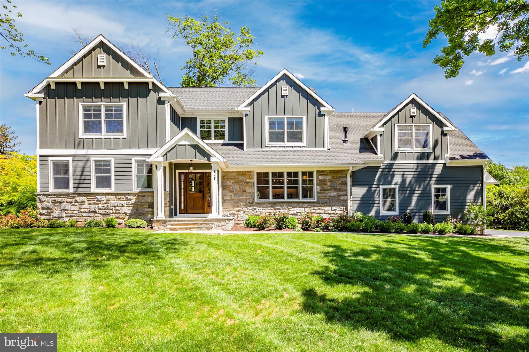 Welcome to 121 Hillside Road. The impressive property offers six or seven bedrooms, five full and one-half bathroom, 4,266 square feet of luxurious above grade living space, a 2-car side entry garage, finished basement, rear deck, flagstone patio, and low property taxes. Located in the desirable Deepdale neighborhood, this home was renovated/expanded in 2021 on a Rene Hoffman design expertly built by Top Notch General Contracting. A flagstone walkway connects the driveway to a covered front entrance portico and a custom mahogany front entrance door. First floor feature include: dining room with dry bar and custom cabinets, fireplace, and quadruple front window; gourmet kitchen with 48” custom white cabinetry, stainless steel appliances, subway tile backsplash, massive island with overhang seating, and quartz countertops; a sundrenched family room with a plethora of windows and gas fireplace with shiplap surround; a mudroom and pantry. Off the foyer is a hallway leading to a bedroom with ensuite bathroom and walk-in closet, two additional bedrooms (both being used as offices), and a full hall bathroom featuring a stall shower with floor to ceiling subway tile. Upstairs you’ll find a gorgeous primary bedroom suite complete with tray ceiling, double walk-in closets, furniture grade double bowl vanity, soaking tub, heated bathroom floors, and a large stall shower with glass enclosure, body sprays, rain shower head, and floor to ceiling Carrera marble tile. Other second floor features include three secondary bedrooms, two full bathrooms, a hallway linen closet, laundry room with cabinets and sink, and an exercise room with rubber floor. The finished lower level adds another 950 sq ft of finished space including a recreation room, TV/gaming area, a half bathroom, and egress windows. Other features of this fine home include abundant recessed lighting throughout, site finished hardwood floors throughout first level, second floor hallway, and primary bedroom, 5 zones of heating and air conditioning utilizing 2 systems, Anderson 400 series windows, James Hardie batten board and horizontal siding, a whole house generator, white oak stairs, exterior soffit lighting, and extensive custom moldings throughout. This home sits on a level lot just under one-half acre, is walking distance to Wayne, the Strafford train station, the Strafford library, is close to all major commuter routes, shopping, restaurants, and is part of the top rated Tredyffrin-Easttown School District.