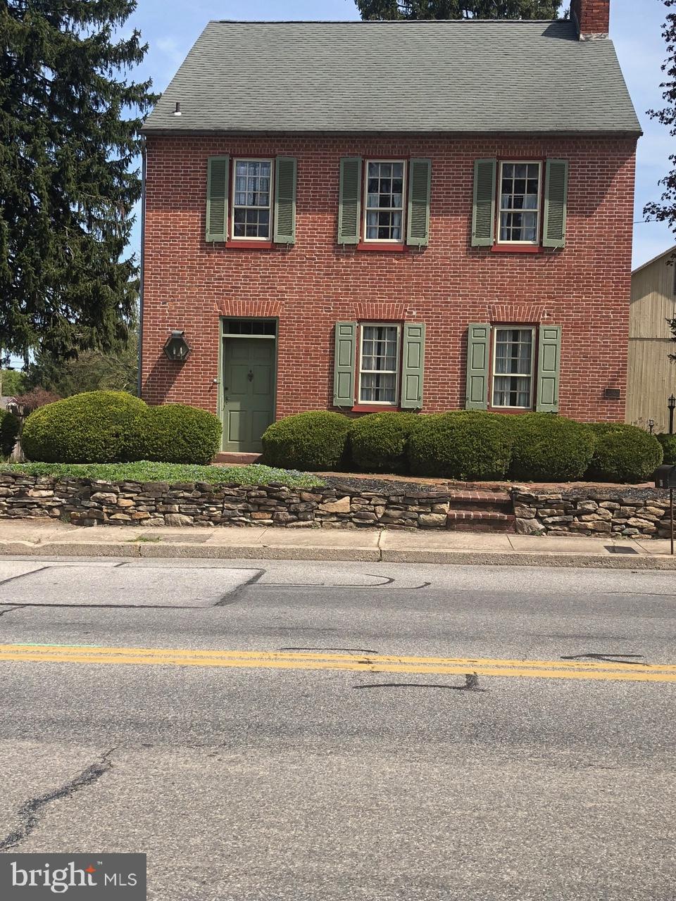 Step into history by entering this prominent 18th century Federal Style home. Built in 1750 by Samuel Fahnstock who also built the famous Harper’s Ferry Bridge. The home was honored in 1990 by the Historical Gettysburg Adams County Society as the Jacobs Farm. Originally a dairy farm located in the quaint town of East Berlin. This home has 2,245 sq.ft, 3 spacious bedrooms, 2.5 baths, eat in kitchen, family room, formal dining and living room and 3 seasons porch with a swing there bank barn and chicken coop all sitting on a 1.04 acre lot. There is wood molding and floors throughout. There are fireplaces in many of the rooms, built in cabinets and bookshelves as well. The bedrooms are located on the 2nd floor which can be accessed by using the wooden stairs and original banister. There is also a chair lift which can be removed if desired. You access all the bedrooms from the 2nd floor hallway. The master bedroom has an attached full bath with a walk in shower. There is also a stand up washer and dryer and a large closet. You access a large cedar closet and attic which was used for storage. From the hallway you can climb 2 steps to the 2nd and 3rd bedrooms and master bath. You can also climb a few steps to the 3rd floor where there is a small room that was used as the workman’s room back in the days. There is a magnificent front door that has its original hardware. To the right of the door is a large corner cabinet. If you enter through the side door of the house you will enter the 3 seasons room which allows you access to the eat in kitchen which also has an impressive wooden door with original hardware. As you exit the 3 seasons room and turn left you walk down a charming brick walkway facing a large bank barn. It has a stone and brick foundation and was stick built. It has hewed wood beams that were pegged together and has a metal roof. In the early days it was known as the largest bank barn in Adams County and was used for community meetings and dances. The previous owner, the renowned Folk artist, Arthur Glazier, known for such works as The Peaceable Kingdom, Victorian Santa’s, Noah and the Ark, had his art studio in the lower level. Today the barn offers parking for your vehicles in both the lower and upper levels and there is plenty of off street parking. There is a chicken coop which Arthur used to stage his wooden boards and sleds, iron boards, chests, Etc that he used for his paintings. You can access the property from either the front entrance off of E. King St. or North St. which is an alley that runs behind the bank barn and coop. The property is within walking distance to the drug store, bank, restaurant, pizza shop and Rutter’s gas station. This is a once in a lifetime opportunity to own a piece of history. You are within driving distance of medical centers in York, Hershey, Gettysburg, Hanover. It is also near many attractions, shopping centers and Antique stores located in Hershey, York, Gettysburg Hanover and New Oxford. Easy access to major highways examples are PA Turnpike, RT # 30, 15, 81, 83 and 94. Directions: From Camp Hill take Rt 15 south 16.6 miles, exit 94 south towards Hanover, make left East Berlin Rd PA 234 for 3.9 miles go through light continue on East King for .9 miles property on left.