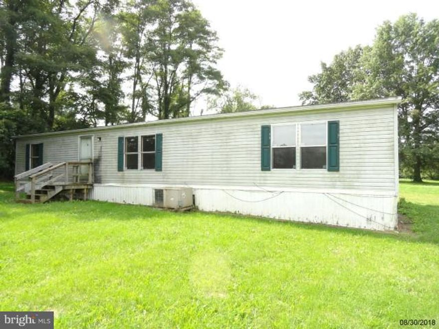 Large Double-wide on nice lot.  Double-wide needs totally redone from top to bottom.  Loads of potential.  Located between New Oxford & Gettysburg.  Wood deck off rear of property, open floor plan, master bedroom and bath.  Off street parking.