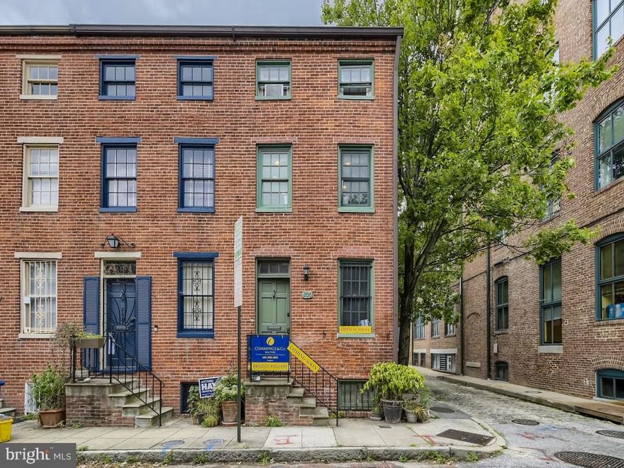 located on  coveted Penn Street. This freshly painted end of group is located within a few step of U of Md professional schools.  Convenient to Inner Harbor, Camden Yards and and Ravens Stadium.  This super clean historic home is not your typical cookie cutter.  It has a lofted living room with views of generous lower level eating area and oversized windows with view of fully fenced rear yard with locked/secured alley.  Kitchen and powder room is located in lower level, main level living room with plenty of exposed brick, second level two bedrooms with center hall full bathroom.  Third level owner's suite offers generous bedroom and tiled full bathroom.  This home is super clean and ready for immediate occupancy.  Please be certain the view the 3D tour and floor plans for all four levels. Home inspections are welcome for informational purposes only.  Sold "as is".  There are no known defects.