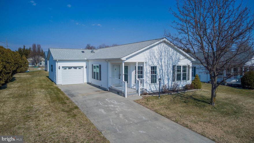 This charming Churchill model home has been thoughtfully updated and carefully maintained with a new roof & new AC (2023), new insulated windows throughout, new carpet, and encapsulated crawl space. Featuring an ample kitchen offering plenty of work and storage space, center island, gorgeous tile floors and backsplash, and a sunny breakfast nook. Spacious living room and formal dining room, two comfortable bedrooms plus a handy den or third bedroom. The primary suite includes a full bath with soaking tub, walk-in shower, double vanity and large walk-in closet.  A large oversized one car garage and all appliances are included.  Located in Barclay Farms; Kent County's premier 55+ active lifestyle community with five star amenities. Community amenities include: pool, clubhouse, fitness center, spa, library, game rooms, walking paths, catch & release fishing pond, fitness classes , various clubs & other activities. Land lease $669.23 per month includes all community amenities, lawn maintenance, trash removal & road maintenance. Conveniently located in Camden Delaware just a short drive to shopping, restaurants, healthcare, the Delaware beaches & more!