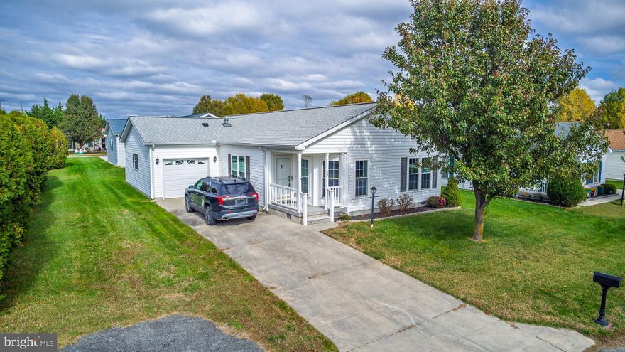 This charming Churchill model home has been thoughtfully updated and carefully maintained with a new roof & new AC (2023), new insulated windows throughout, new carpet, and encapsulated crawl space. Featuring an ample kitchen offering plenty of work and storage space, center island, gorgeous tile floors and backsplash, and a sunny breakfast nook. Spacious living room and formal dining room, two comfortable bedrooms plus a handy den or third bedroom. The primary suite includes a full bath with soaking tub, walk-in shower, double vanity and large walk-in closet.  A large oversized one car garage and all appliances are included.  Located in Barclay Farms; Kent County's premier 55+ active lifestyle community with five star amenities. Community amenities include: pool, clubhouse, fitness center, spa, library, game rooms, walking paths, catch & release fishing pond, fitness classes , various clubs & other activities. Land lease $669.23 per month includes all community amenities, lawn maintenance, trash removal & road maintenance. Conveniently located in Camden Delaware just a short drive to shopping, restaurants, healthcare, the Delaware beaches & more!