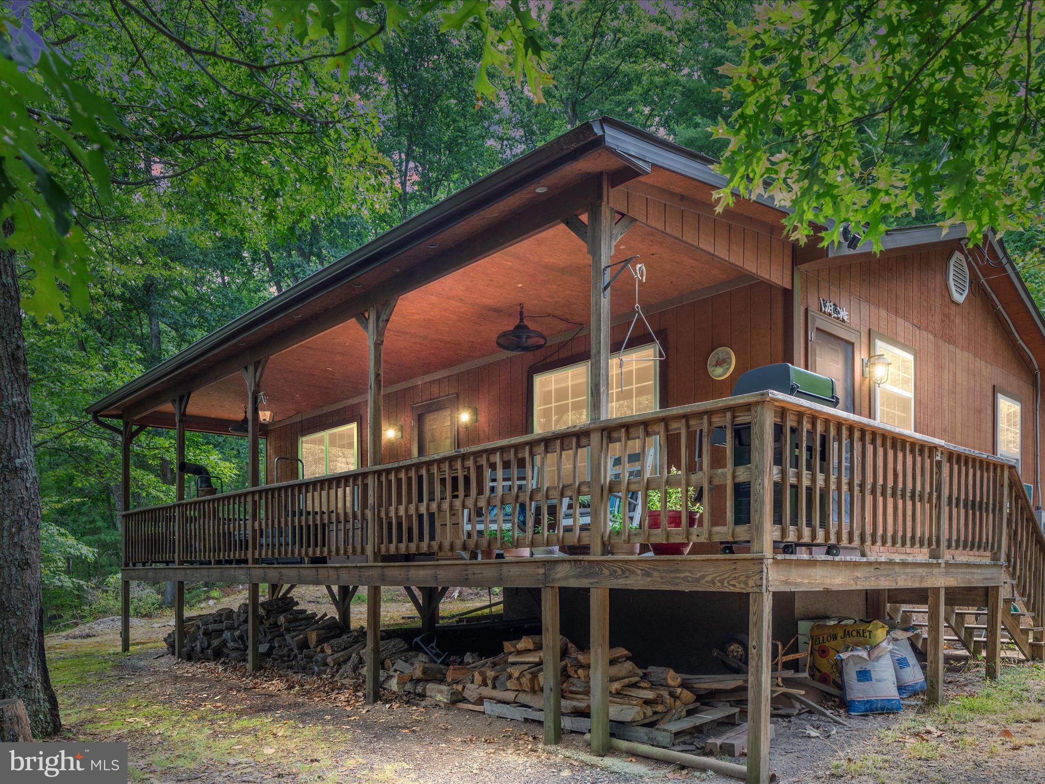 Welcome to your perfect retreat nestled in the heart of Capon Bridge, WV. This charming 2-bedroom, 1-bath cabin is set on over 5.4 acres of pristine land, offering you the ultimate escape from the hustle and bustle of city life. Imagine sipping your morning coffee on the spacious front porch, surrounded by the serenity of towering trees and the sounds of nature.Â
This convenient location is less than two hours from Leesburg, VA with easy access to Route 50, a short drive to Capon Bridge and the Cacapon River. You are never far from the amenities because this cabin also has access to Frontier internet; stay connected while enjoying the tranquility.
There are many perks about this sought after community in addition to the peace and quiet of your own space. There is a stocked lake for fishing, a swimming lake, a community beach with a sand park, tennis courts, playground, and picnic pavilion. This is a 4-wheeler friendly community as well! Whether you're looking for a weekend getaway or a place to call home year-round, this cabin offers the perfect blend of seclusion and convenience. Embrace the beauty of nature and the comfort of a well-equipped cabin in this sought-after neighborhood. Don't miss out on making this dreamy escape yours!