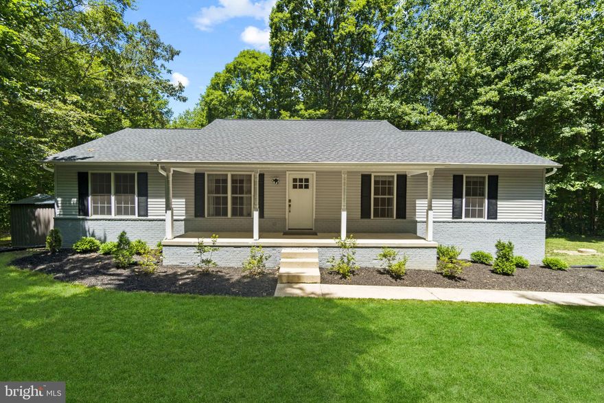 Welcome to your private oasis!  Sited on 3.5 acres down a private street, this home is fully updated and move in ready!  Major renovation in 2020, and a new roof in 2022.  Open Concept with  Main Level living room, kitchen with granite counter tops, stainless appliances and  island seating and dining room.  4 bedrooms on the main level, including the Primary Suite with 2 walk in closets and a gorgeous spa bath.  Freshly painted deck over looking the trees.  Lower Level has a large additional great room, gym/bedroom, office, spacious laundry room, and another full bath.  Could be a seperate living space with it's own entry.  Minutes to Chesapeake Beach, close to Andrew's and Ft. Meade.