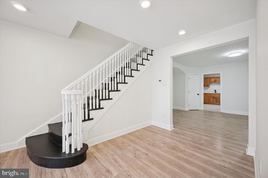 Welcome to 5232 Arlington Street, a well-located Philadelphia property offering strong potential for homeowners or investors alike. Situated on a quiet residential block, this home features a classic Philadelphia layout with generously sized rooms and a functional floor plan. The property offers solid bones and an opportunity to add value through updates and personalization.
The main level offers a bright and inviting living room, complemented by a convenient half bath located just off the living area—ideal for guests. Continuing through the home, you’ll find a spacious dining area that comfortably accommodates a full dining set and provides a seamless transition into the kitchen, creating a practical and functional layout for everyday living and entertaining. The kitchen is updated with abundant natural light, featuring warm wood cabinetry, sleek white countertops, and a classic subway tile backsplash. The space is equipped with a stainless steel gas range, built-in microwave, and full-size refrigerator. Durable tile flooring and a bright overhead light fixture create a clean, functional workspace with easy flow into the adjoining living area—ideal for everyday cooking and entertaining. Laundry is on the first floor in the rear.
Conveniently located near public transportation, major roadways, local shops, schools, and neighborhood amenities, this home provides easy access to Center City and surrounding areas. Whether you’re looking for a primary residence or an investment opportunity, 5232 Arlington Street presents a practical option in an established community.