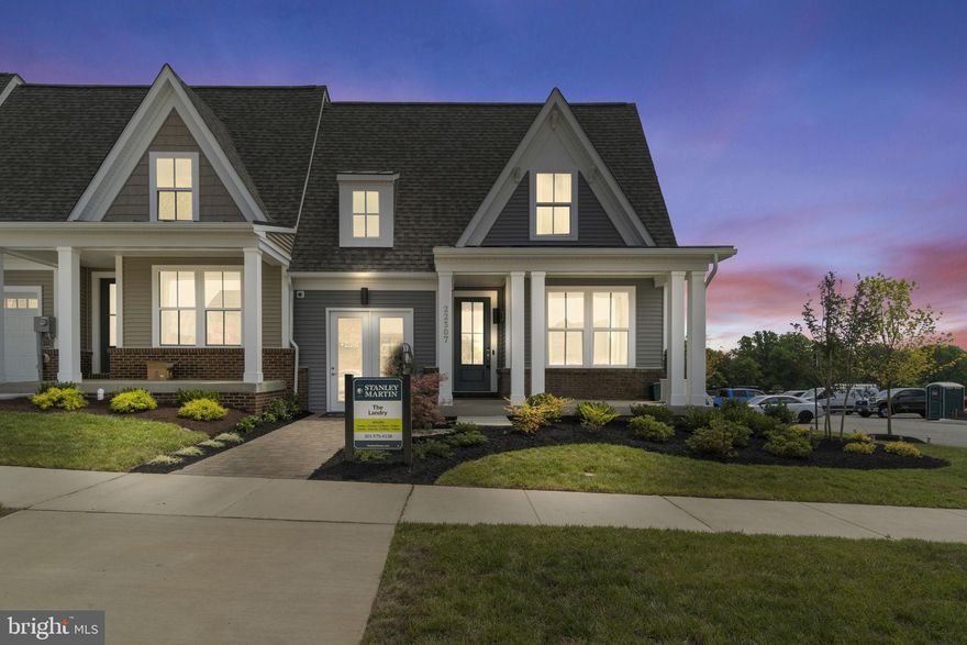 **This is a 55+ neighborhood** The Landry is one of Stanley Martin's newest main-level living home designs featuring a smart open-concept floorplan, 1-car garage, energy-efficient features and outdoor living space. Enjoy main-level living with everything you need located right on the first floor including a spacious kitchen with pantry for extra storage, dining area, and and impressive primary suite with a walk-in closet and double vanity bath. You'll also find a laundry room conveniently located near the garage entry. Enjoy the front and rear patio off the family room perfect for unwinding after a long day or for entertaining. This home includes a lower level with a finished basement, an additional bedroom and bathroom, rec space perfect for football Sunday or movie nights, and 500 square feet of unfinished storage space to hold any additional things you need! The Landry perfectly balances low-maintenance living and a single-family home's spaciousness! This home also features a parking spot in the driveway in front of the 1-car garage.  Photos shown are from a similar home. Contact us to schedule a tour or stop by our model home today!
At The Village at Cabin Branch, enjoy onsite amenities including a clubhouse and firepit, a community garden, an open lawn area, a fitness center, bocce ball courts, pickleball courts, and walking paths. You will have quick access to dining, shopping, and entertainment, as well as the convenience of living close to family in and near Montgomery County, where you can spend more time with those who matter most.  Visit us today!