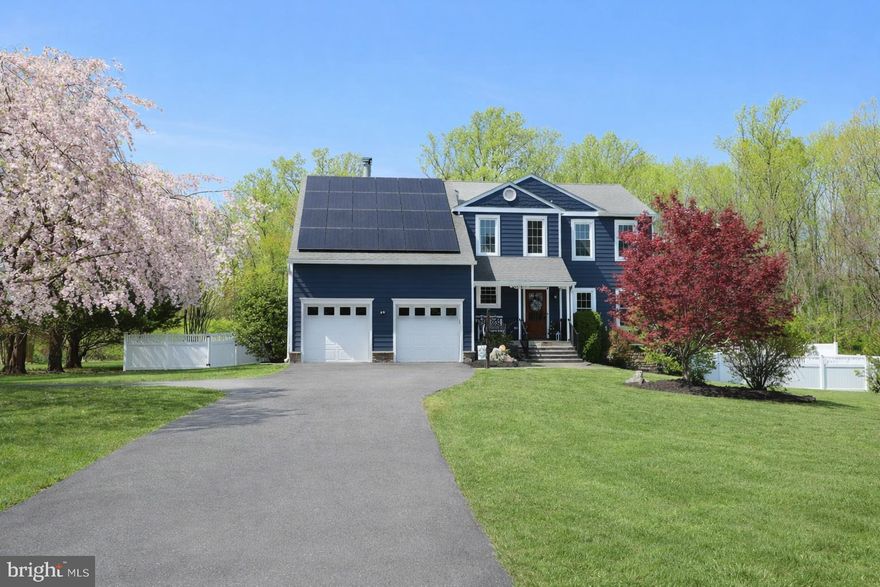 This exceptional 5-bedroom, 3.5-bath residence in sought-after Eagles Passages seamlessly blends luxury upgrades with everyday comfort, offering a true retreat-style living experience.

A wide driveway framed by blooming cherry blossoms welcomes you home, complemented by a paver walkway and inviting bluestone front porch. The backyard is designed for both relaxation and entertaining, featuring a Gunite pool (2022) with year-round climate control- capable of both heating and uniquely cooling the water- adjacent to a large stone paver patio with a built-in fire pit, a composite deck, and a fully cleared, level, and fenced yard backing to private wooded surroundings for an elevated sense of privacy in your ambiance filled entertaining space.

Inside, a dramatic two-story foyer sets the tone and leads into the fully reimagined kitchen (2023). This stunning space showcases custom cabinetry with soft-close drawers and tailored storage solutions, an expansive nearly 10-foot island, quartz countertops, a La Cornufe gas range with commercial-grade hood, a paneled Dacor refrigerator, and a wet/coffee bar complete with beverage fridge and Zip system offering hot, cold, and sparkling water.

Upstairs, the primary suite features vaulted ceilings and a beautifully appointed bathroom with dual vanities, a tiled shower with bench, and a spacious walk-in closet with a custom organization system. Three additional bedrooms, a full bath, and convenient upper-level laundry are connected by an open landing overlooking the foyer, allowing natural light to pour into the upper level.

The fully finished lower level offers a versatile walk-out recreation and fitness space with mat flooring for functional training, a fifth bedroom, and a beautifully upgraded full bathroom- ideal for guests or extended stays.

Additional highlights include a zoned HVAC (2024), a water treatment system (2024), two buried propane tanks (2022), Hunter Douglas motorized shades, electric vehicle charger, a Tesla powerwall back up charger that powers Sunrun solar panels, and newly added insulation in both the basement and attic for enhanced efficiency.

Residents enjoy access to community amenities including a pool, sport courts, pavilion, playground, and access to the South River with a pier and canoe/kayak launch.