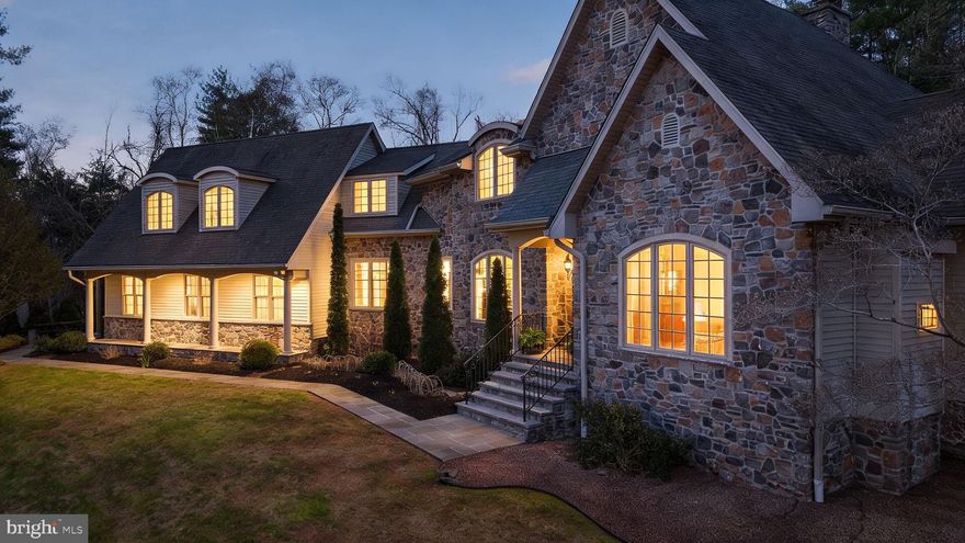 Nestled on a breathtaking 5.32-acre wooded homesite, this meticulously designed European-inspired stone estate offers exceptional privacy and timeless craftsmanship in a truly remarkable setting. Bordering Rocks State Park, picturesque horse farms, historic homes, and scenic Deer Creek, the property provides a rare blend of natural beauty, tranquility, and refined living. Thoughtfully designed and impeccably maintained, the residence showcases elegant architectural details throughout. The main-level primary suite serves as a private retreat, featuring direct access to a bluestone patio and a distinctive turret-style cathedral ceiling that creates an airy and dramatic space. Inside, rich wood flooring, clear wood trim, and custom millwork highlight the home’s exceptional craftsmanship. A sophisticated library with a fireplace offers the perfect place to relax or work, complete with custom wood paneling and built-in bookshelves that add warmth and character. Surrounded by nature, the grounds have been professionally designed to complement the home’s character. Natural stone steps, cobblestone accents, and thoughtfully curated gardens filled with herbs and perennials create a serene outdoor environment that blends seamlessly with the surrounding landscape.
This extraordinary property offers a rare opportunity to experience privacy, natural beauty, and refined living in one of Harford County’s most picturesque settings.