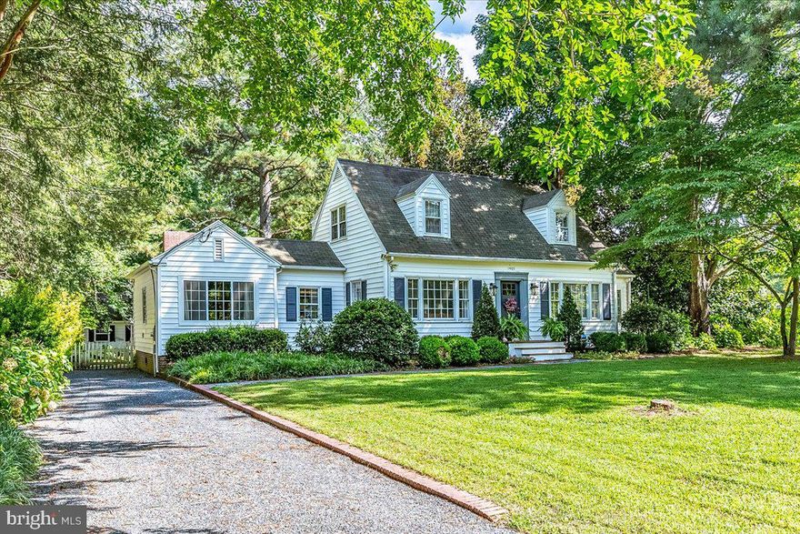 Nestled on a .54-acre corner lot, this 2089 sq ft, 3 bedroom, 2 full bath residence has a quaint cottage 'feel' and is filled with charm! The 1st floor features a formal living room w/ fireplace and access to the window-filled sunroom, an inviting dining room that leads to the eat-in kitchen w/ farm sink and gas range, a cozy den, a bedroom w/ fireplace, and an updated bathroom w/ shower. Hardwood stairs lead to 2 bedrooms with dormers, a hall bath and laundry room. Exterior features include in ground irrigation w/ private well, a private back yard surrounded by a picket fence, paver patio, and a detached one-car garage. Conveniently located close to Downtown Salisbury, Tidal Health and Salisbury University, the home also offers public water and sewer with NO city taxes!