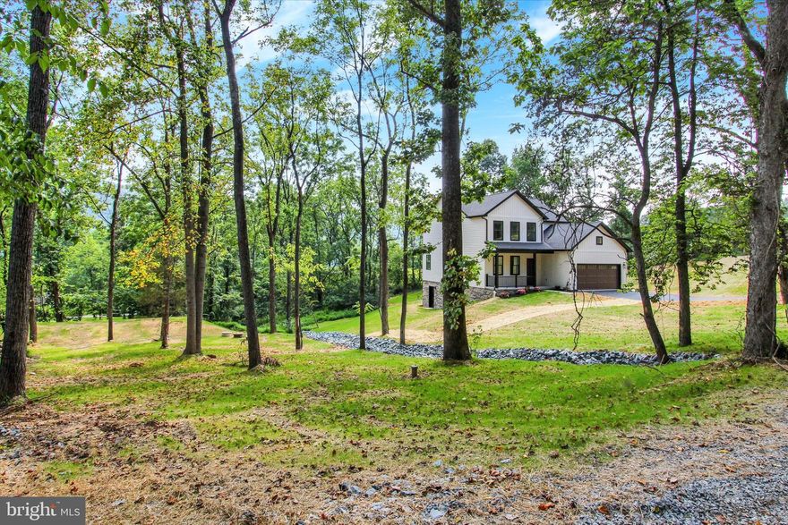 Skiing and golfing only 10 minutes away at Liberty Mountain Resort! This brand new home is located at the end of Possum Trail with almost a one acre partially wooded lot that will make you feel like you are at your own private park.  Home features an in home office, covered back deck with a view of the mountain, black stainless kitchen appliances, large island, large walk-in kitchen pantry, 9 ft ceilings on 1st floor, cathedral ceilings in master bedroom, master bathroom with soaking tub and tile shower, all bedrooms have large walk-in closets, luxury vinyl plank throughout entire home.  All closets and pantry have solid painted shelving, no wire shelving here! Walk out basement also has 9 ft ceilings. Two zone heating/AC, separate thermostat and zones on main and second level.  Exterior outlet for generator use if you would happen to lose power due to an outage, comes with the power cord all you need is a generator! Taxes listed are for LAND ONLY.