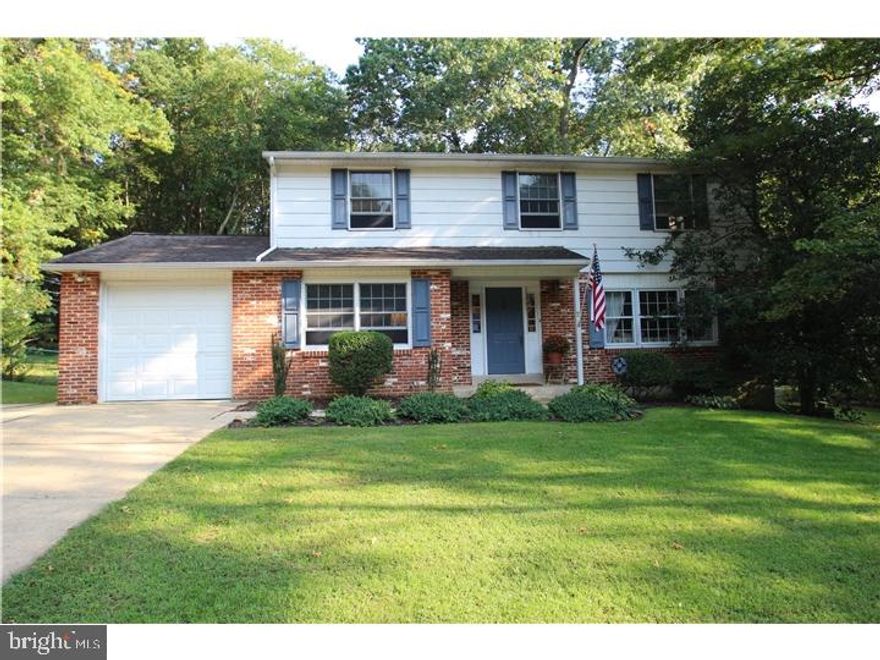 Welcome to this charming Colonial-style home located in Newark in Chapel Hill that sits on a beautiful fenced in lot backing to the woods. Within the 5 mile radius of Newark Charter School this lovely home has 4 bedrooms, 2 1/2 baths. Upon entering the foyer, with crown molding and gleaming hardwood flloors you are greeted with steps to the second floor or you may enter the main floor area with with the family room to the left and formal living room to the right that boasts natural light through the large front window. Walk into the dining area which provides an open concept to the updated kitchen. With stainless steel appliances, updated backsplash, cabinets and butcher block counter tops, gas cooking this kitchen will not disappoint! The kitchen includes  a dishwasher, disposal, oven/range, refrigerator, and a washer and dryer for added convenience.Complete with an updated powder room and laundry area on the main floor you also can enjoy the step down sun room with fire place which leads to a patio and fenced in yard perfect for entertaining or relaxing after a long day. The Primary bedroom suite with walk-in closet has a private bathroom. Park in the oversized garage that can accomodate 1 car or park in the driveway which can provide parking for 4 cars. Schedule your private tour today. Home being sold "As-Is".