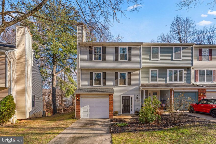 Welcome to 10314 College Square, a beautifully updated end-of-group townhome backing to woods in the heart of Columbia — offering rare privacy, walkability, and lifestyle in one exceptional package.

Tucked against a wooded backdrop, this home enjoys peaceful views and added privacy while still being just steps from Merriweather Post Pavilion and the vibrant Merriweather District. Concerts, dining, festivals, trails, and lakes are all part of everyday life here.

Inside, you’ll find over 2,050 finished square feet, 3 bedrooms, 2.5 baths, a finished lower level, and a 1-car garage. The updated kitchen (2022) features white cabinetry, stainless steel appliances, subway tile backsplash, pantry storage, breakfast room, and a new slider leading to a brand-new deck (2025) — overlooking the woods and perfect for indoor-outdoor living. The main level also includes hardwood floors and a cozy wood-burning fireplace.

Upstairs, the spacious primary suite offers great closet space and an updated en-suite bath with a new shower insert. All bathrooms throughout the home have been updated, creating a truly move-in-ready experience. Two additional generously sized bedrooms and a renovated hall bath complete the upper level.

Major improvements provide peace of mind: new roof (2024), HVAC & hot water heater (2022), poly piping replaced (2025), new windows (2022), new carpet (2025), new deck (2025), and a new sliding door (2025). Fully fenced yard, weather room, and thoughtful updates throughout.

HOA note: This home has one fee only — the Columbia Association annual assessment. That fee grants access to Columbia’s extensive network of walking and biking trails, lakes, pools, fitness centers, and recreational amenities at a significantly discounted resident rate.

Located in the Village of Hickory Ridge, backing to woods and close to everything Columbia has to offer — this is a rare opportunity to enjoy privacy without sacrificing location.