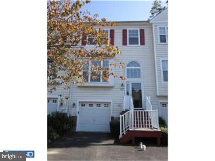 Beautiful Charlestown Oaks 3 bedroom 2 full 1 half bath Townhouse. Custom Kitchen with upgraded cabinetry, lighting and new stainless steel refrigerator, Butler's pantry, center island and walk-in pantry and new hardwood floors; Step down family room with gas fireplace and access to spacious trex deck overlooking wooded lot. Expanded Master Suite with his & hers closets adjoining master bath equipped with double bowl marble vanities, sunken garden tub and separate shower. Two additional bedrooms and full hall bath . Additionally there is a fully finished walk-out basement equipped with recessed lights, Berber carpeting and separate laundry room. Slider doors open out to paver patio. Cul-de-sac lot! Wonderful community with over 92 acres of wooded space, nature trails, tot lots and tennis courts. Close to major routes and shopping. Award winning school district!
