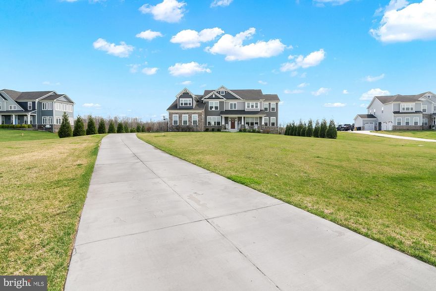 **Open House - Saturday, April 4th, 11-1 pm** Welcome to 1619 Carnoustie Road, an exceptional luxury estate nestled on 2 pristine acres in the highly sought-after Southern Hills community of Davidsonville. Offering over 7,600 square feet of beautifully designed living space, this impressive home combines elegance, comfort, and resort-style living with breathtaking views of the Renditions Golf Course.

From the moment you enter, you are greeted by a grand staircase and a gracious sitting area that sets the tone for the home’s sophisticated design. To the right, a private office or flex space features its own secluded deck—perfect for working from home or enjoying a quiet retreat. To the left, a formal dining room provides an ideal setting for hosting, while the main living room ahead showcases a warm gas fireplace and seamless flow for everyday living.

The heart of the home is the expansive chef’s kitchen, complete with stainless steel appliances and generous space for gathering and entertaining. Just beyond, a large screened-in porch and extended deck overlook the golf course, creating the perfect backdrop for indoor-outdoor living.
A rare main-level primary suite offers flexibility for multi-generational living or guest accommodations, complete with a full en suite bath.

Upstairs, you’ll find four spacious bedrooms, each with its own private en suite bath. The luxurious primary suite is truly a retreat, featuring stunning golf course views, a private mini kitchen, and a spa-inspired bathroom with dual vanities, a jetted soaking tub, and a walk-through shower with dual entries. Connected to the suite is a versatile flex space, ideal for a home gym, studio, or additional private lounge.

The fully finished lower level is designed for entertainment, featuring a dedicated movie theater, expansive recreation area, full bar, an additional bedroom, and a full bathroom—perfect for guests or extended stays.

Additional highlights include dual laundry rooms on both the main and upper levels, thoughtful layout for modern living, and exceptional indoor and outdoor spaces throughout.

This is luxury living at its finest in one of Davidsonville’s most prestigious communities!